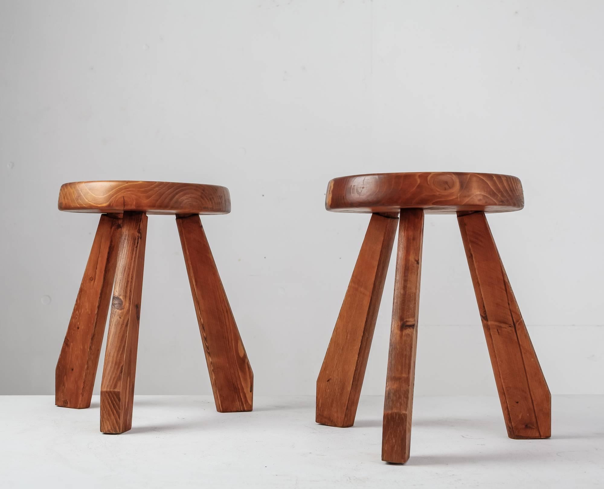 A pair of Charlotte Perriand Sandoz stools with a round and thick seating with a 32 cm diameter. The wood has an amazing patina.

This 'Sandoz' type, with their typical feet, was originally designed circa 1955 and was used in Perriand’s own chalet