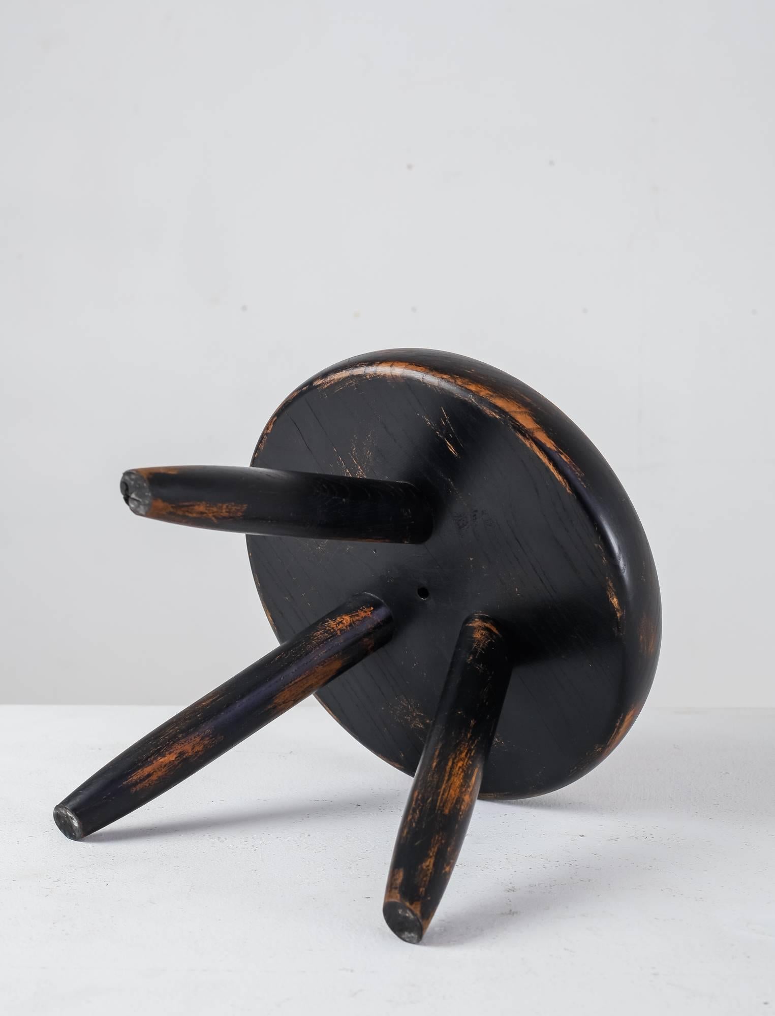 French Charlotte Perriand Low Black Ash Tripod Stool, France, 1950s-1960s For Sale