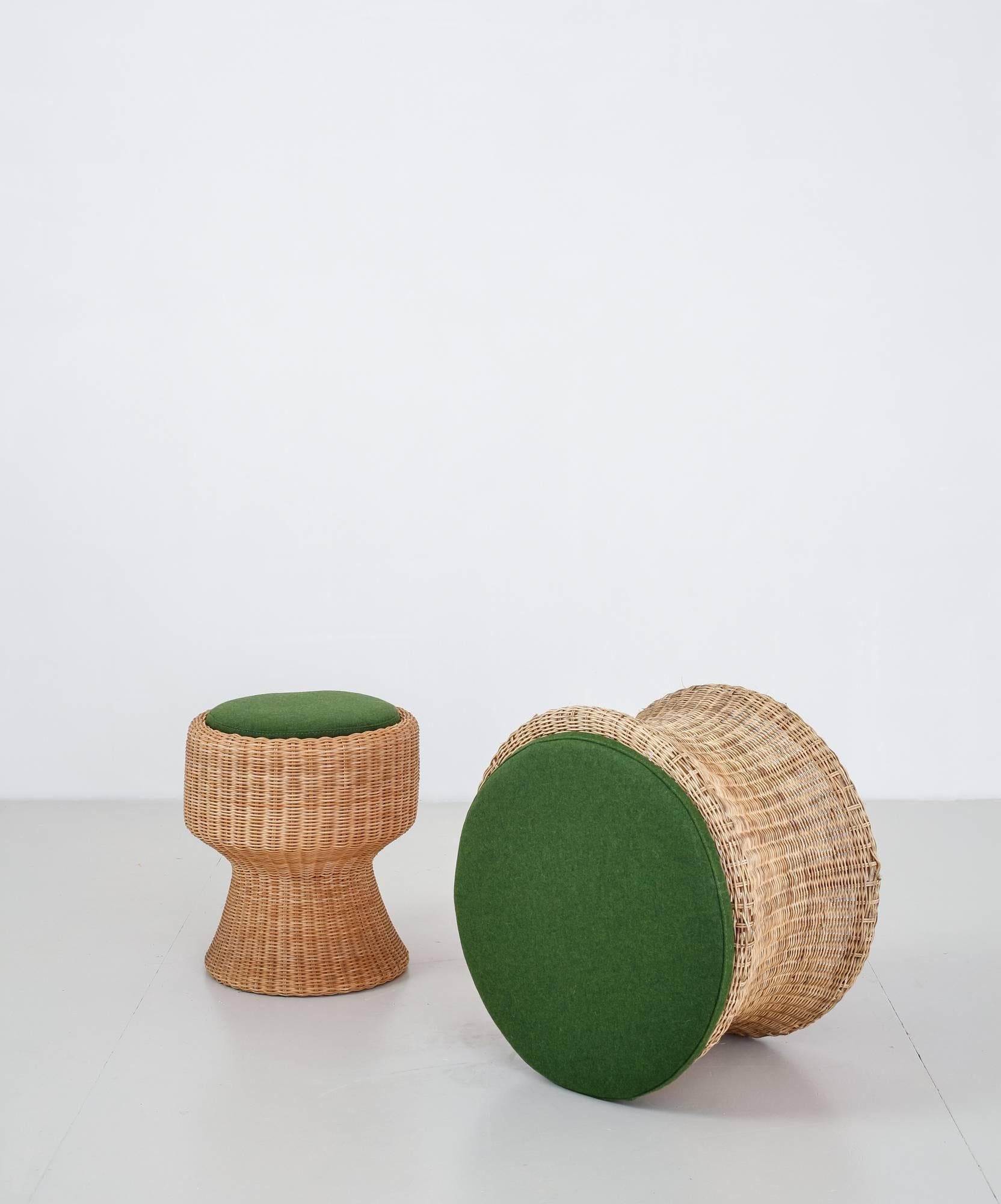 A gorgeous set of two Finnish Mid-Century 'Juttu' ('story') stools, designed by Eero Aarnio in 1961 and handmade by Sokeva. The stools are made of wicker on a bamboo frame and have loose, thick cushions with a green fabric upholstery.

The