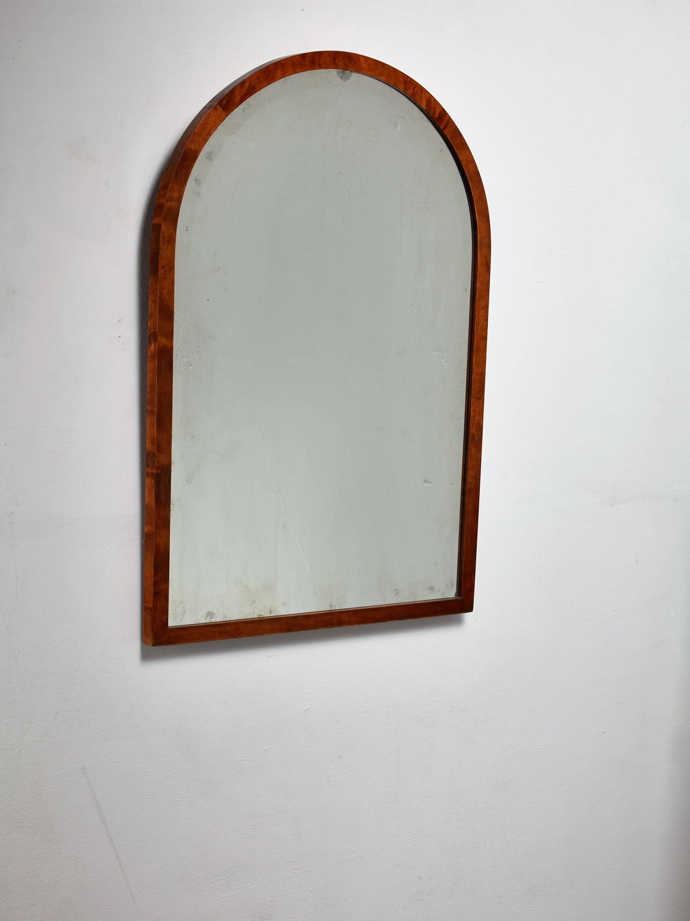 A Swedish wall mirror by Svenska Möbelfabrikerna Bodafors. The mirror has an arched, stained birch frame.
Labelled by SMF and in a very good condition.

