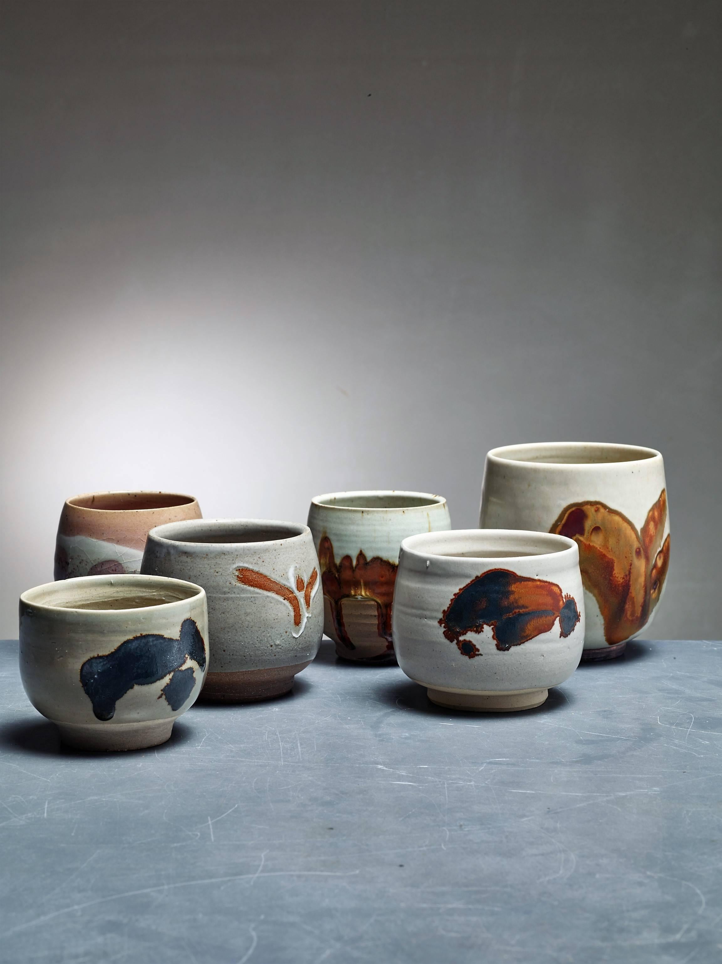 A set of six ceramic vases with an earth-tone glaze finish and abstract figures, by Rolf Palm.

The pieces are signed by Palm, some with the year of production. Measures: The shortest vase is 8.5 cm (3.3 inch) high with a 10.5 cm (4 inch) diameter.