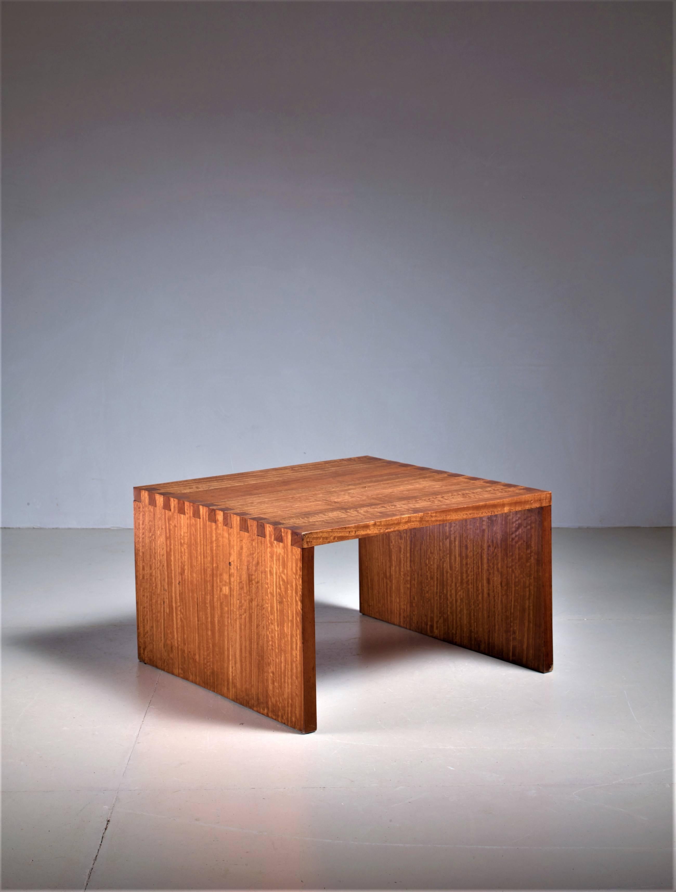 A wonderfully made side table in solid citrus wood. Beautiful connections and a warm patina. Caillette grew up amongst wood, as his father was a woodworker. 
For René-Jean the combination of functionality and simplicity created the most beautiful