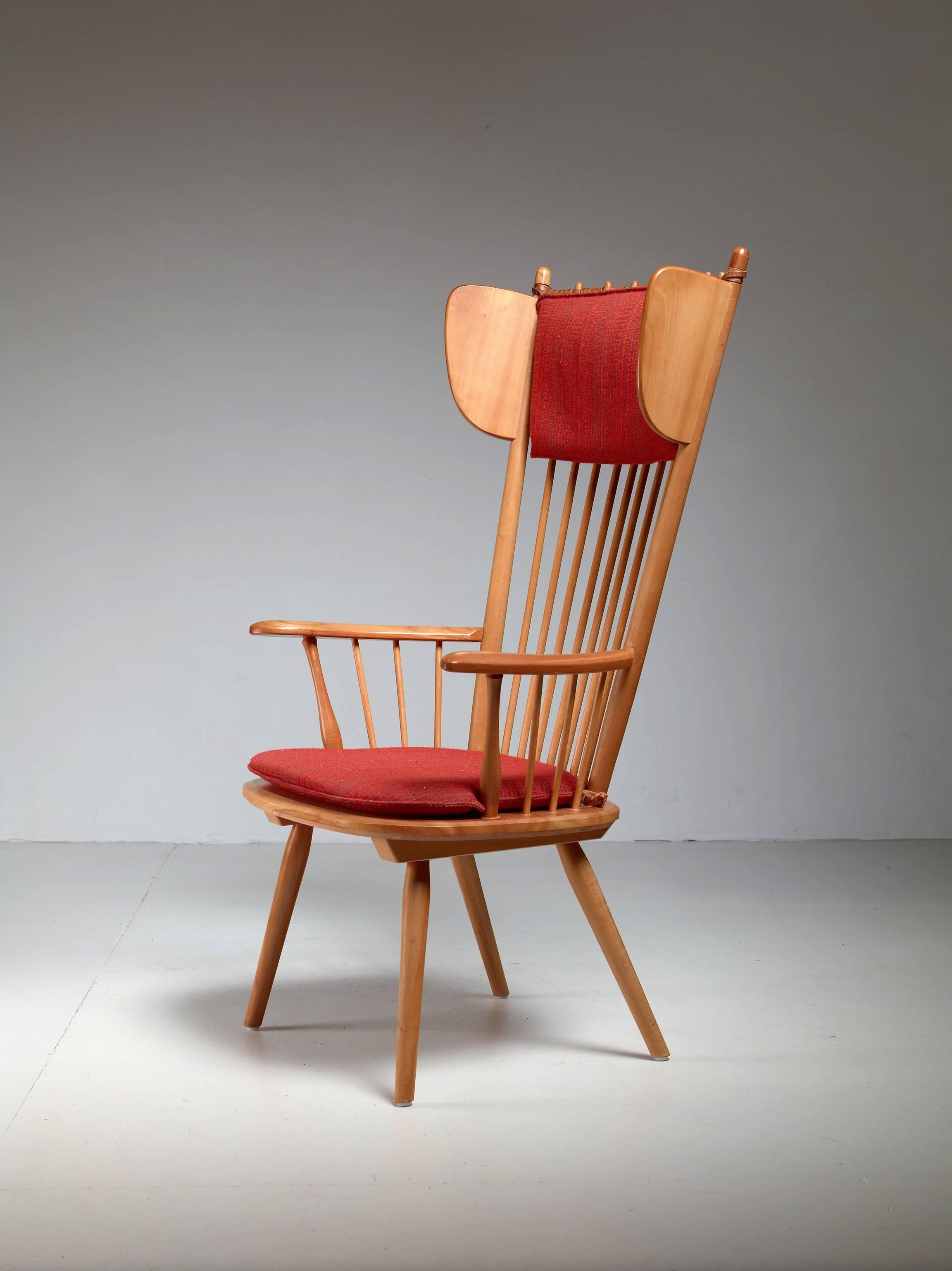 A rare high wingback edition of the architectural arts and crafts chair by Albert Haberer for Hermann Fleiner, Stuttgart, circa 1949.
The flexible backrest is made of thin spindles, held together with a leather connection. The leather is a beautiful