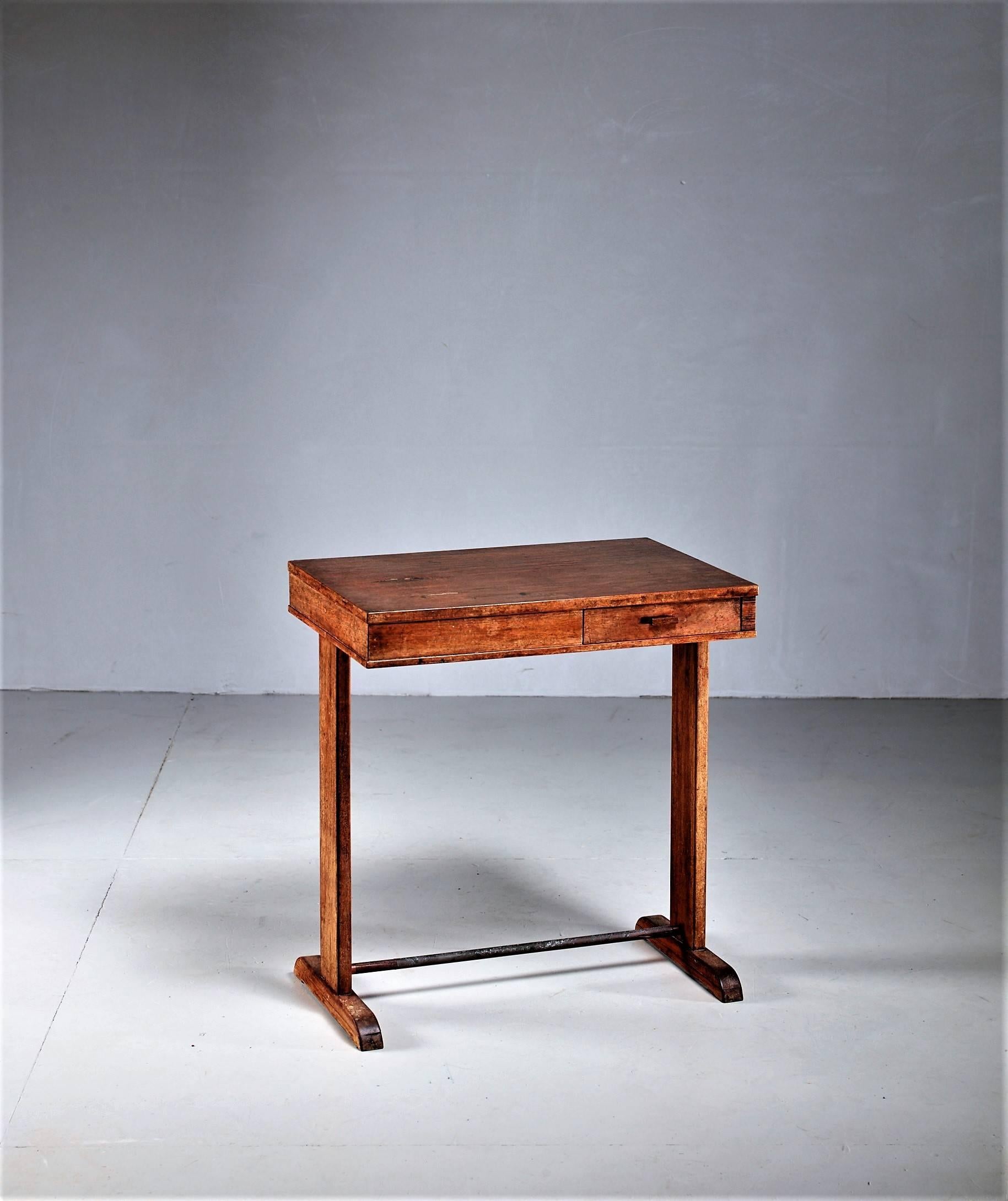 A small mahogany desk or side table by Danish designer Peder Moos, with a small drawer on each side. Apart from a few items for Fritz Hansen, Moos made all his furniture himself and directly for clients. This piece is especially unique, as it was
