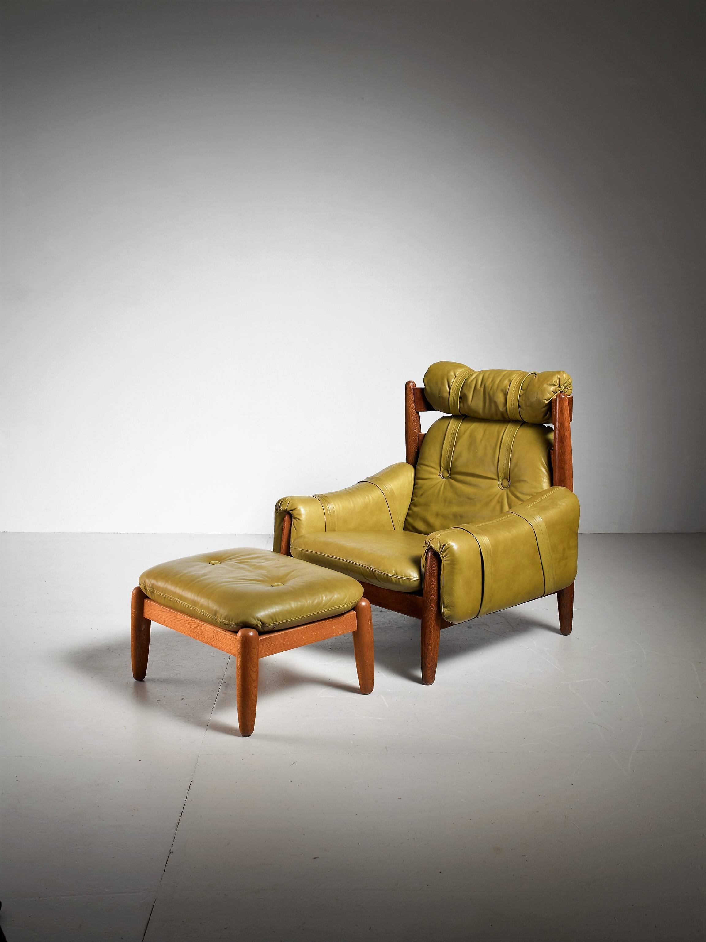 A Brazilian lounge chair with a matching ottoman in the manner of Percival Lafer. They are made of oak with green leather cushions.

The measurements stated are of the chair. The ottoman is 46 by 61 cm.
