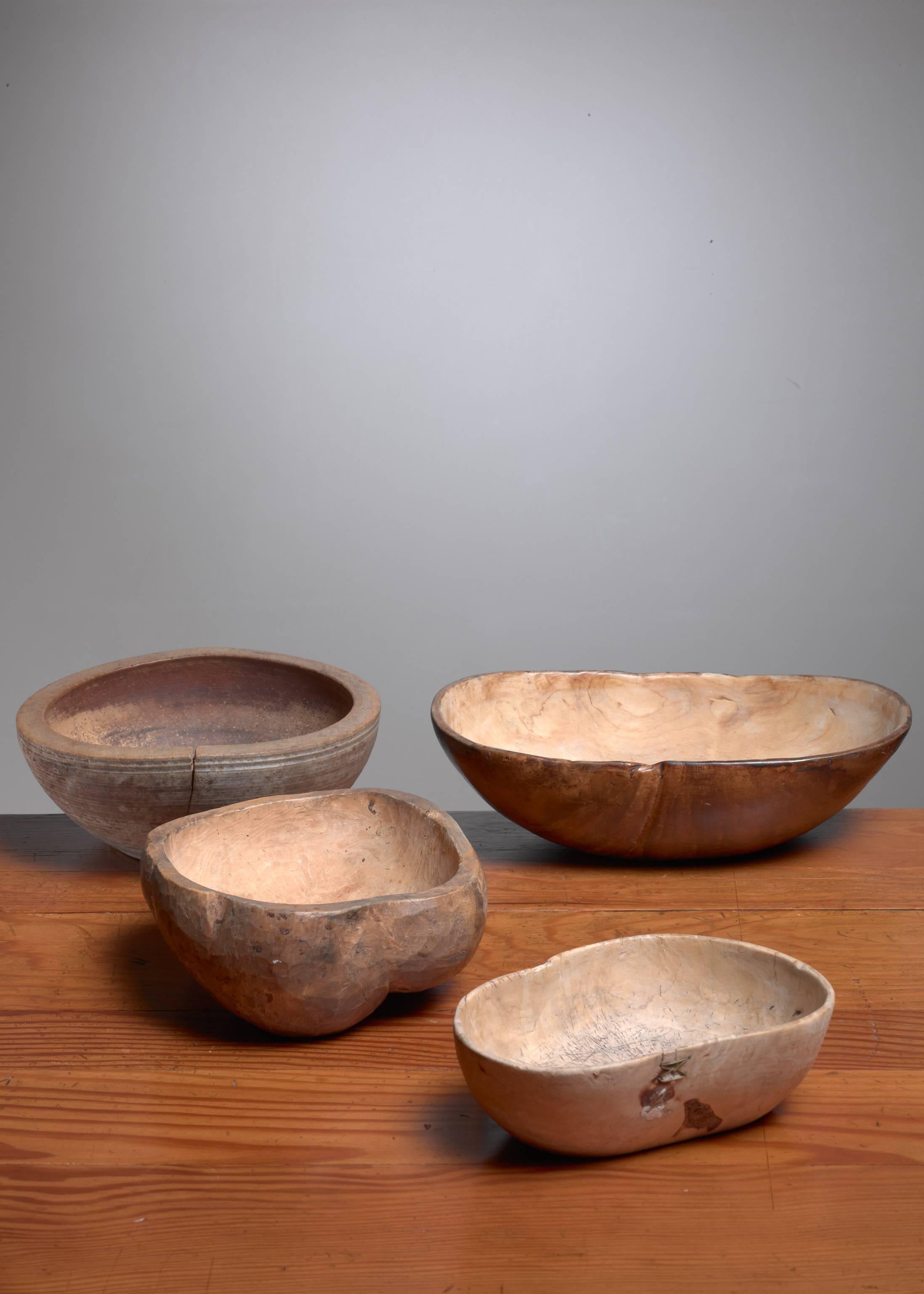 A set of four 19th century Folk Art wooden bowls from Sweden.

The two round bowls have a 23/24 cm (ca. 9 inch) diameter and are 9/10 cm (circa 3.5 inch) high. The other smaller bowl is 20 by 14.5 cm (8 inch by 5.5 inch) and is 7 cm (2.8 inch) high.
