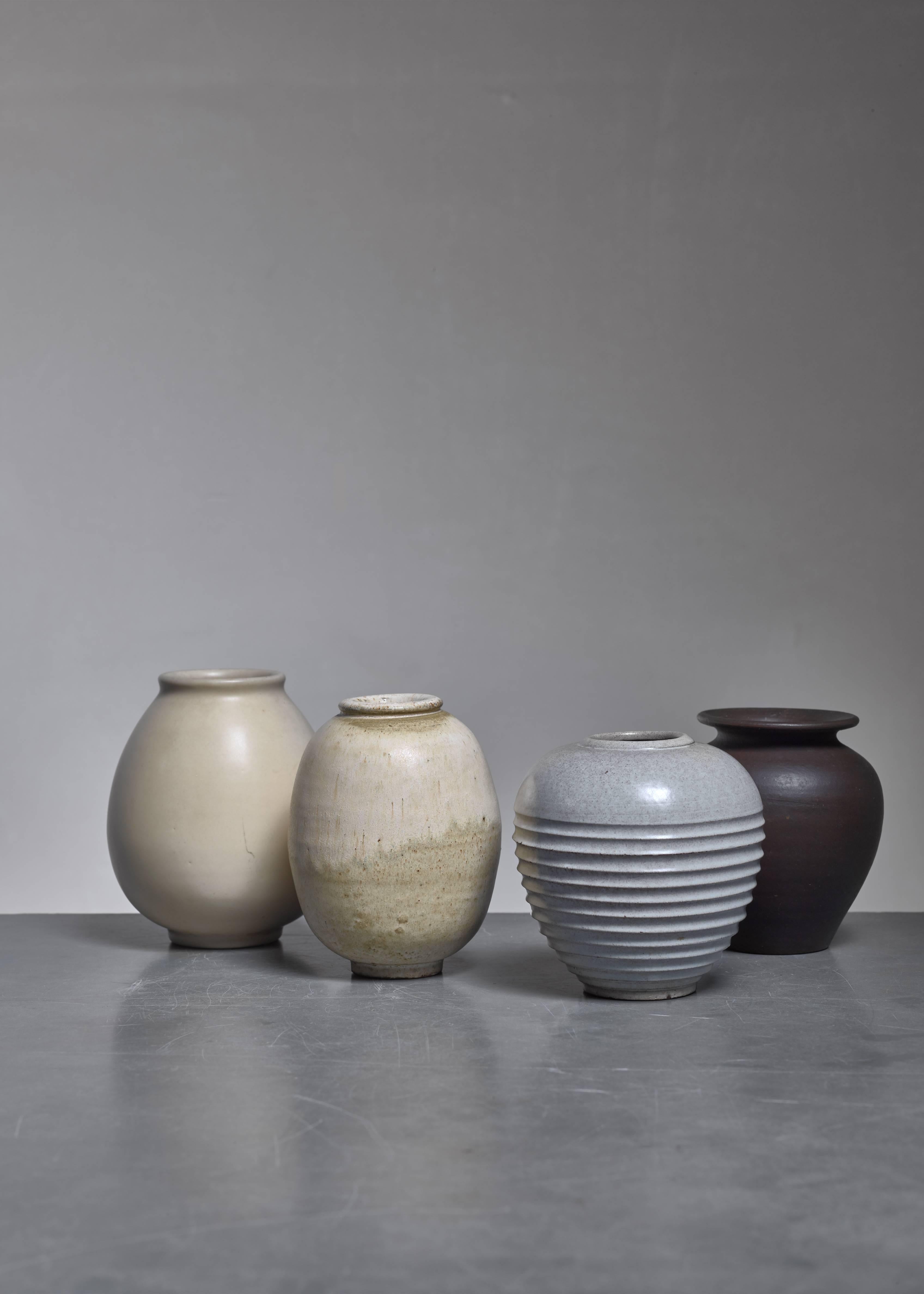 A set of four earthenware vases with light and dark glazing, by Jan Bontjes Van Beek. The height varies between 10 and 11.5 cm.
Three vases are marked by Bontjes and one by Alfred Ungewiss (where Bontjes worked from 1950 to 1953).
Jan Bontjes Van