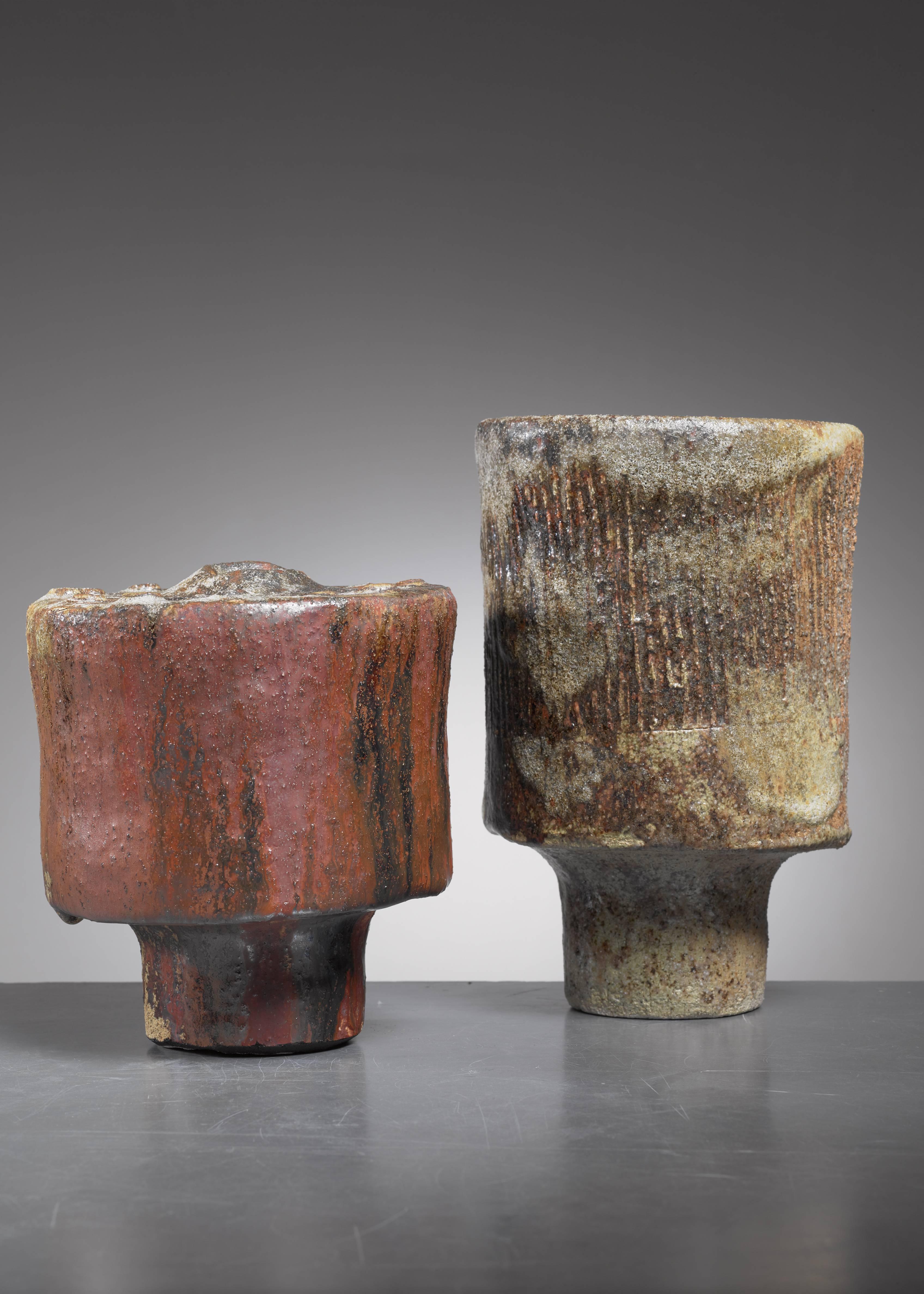 A pair of cylindrical ceramic vases with an earth tone glazing, by Spanish born ceramist José Berlanga (1947).

The measurements stated are of the brown vase. The taller vase is 23 cm high with a 15 cm diameter.