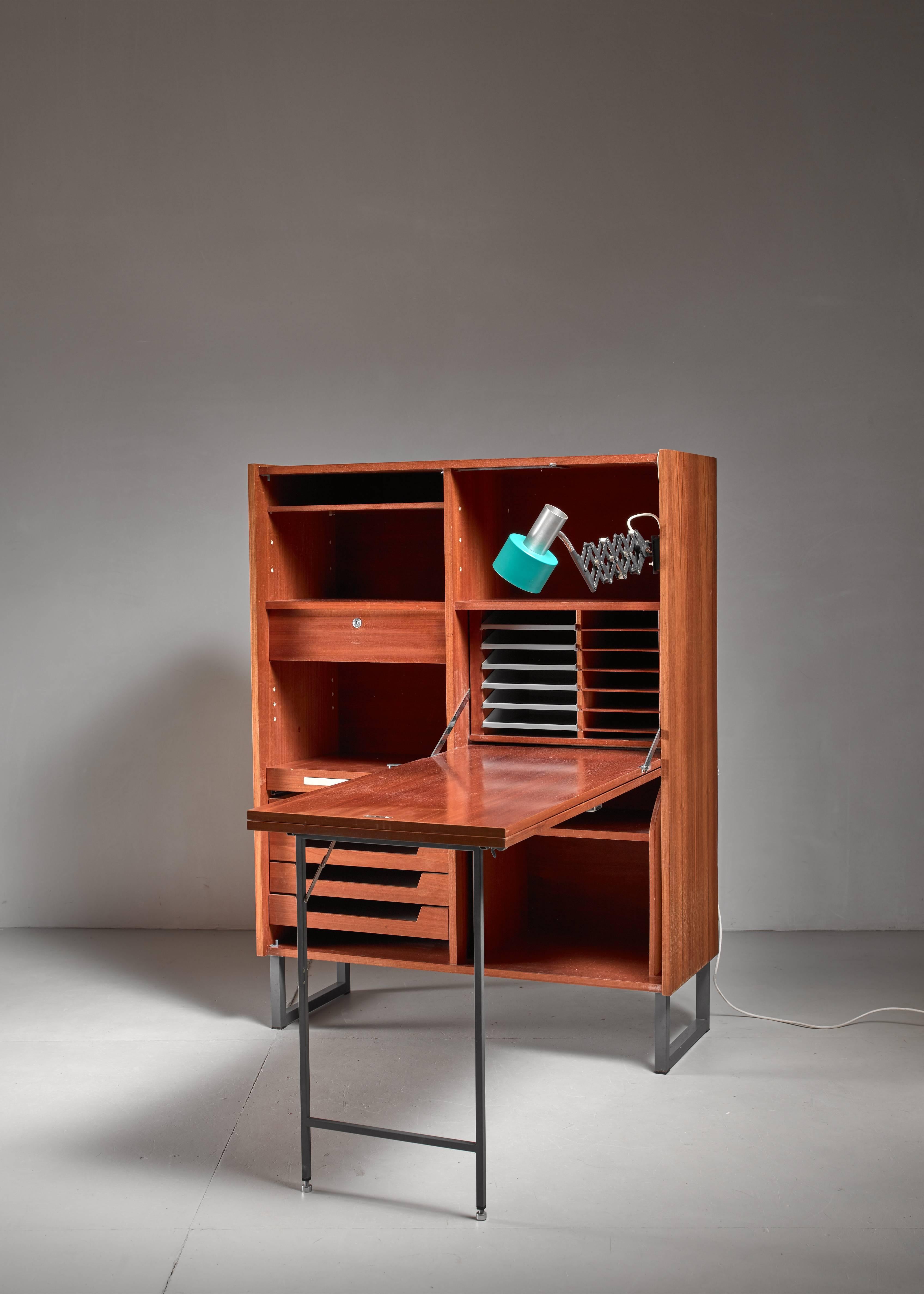 Home secretaire that easily folds up into a lockable cupboard. It has beautiful drawers and a bakelite pencil case, hidden in one of the drawers. With an additional lockable inside drawer and large storage capacity. Dimensions stated are of the