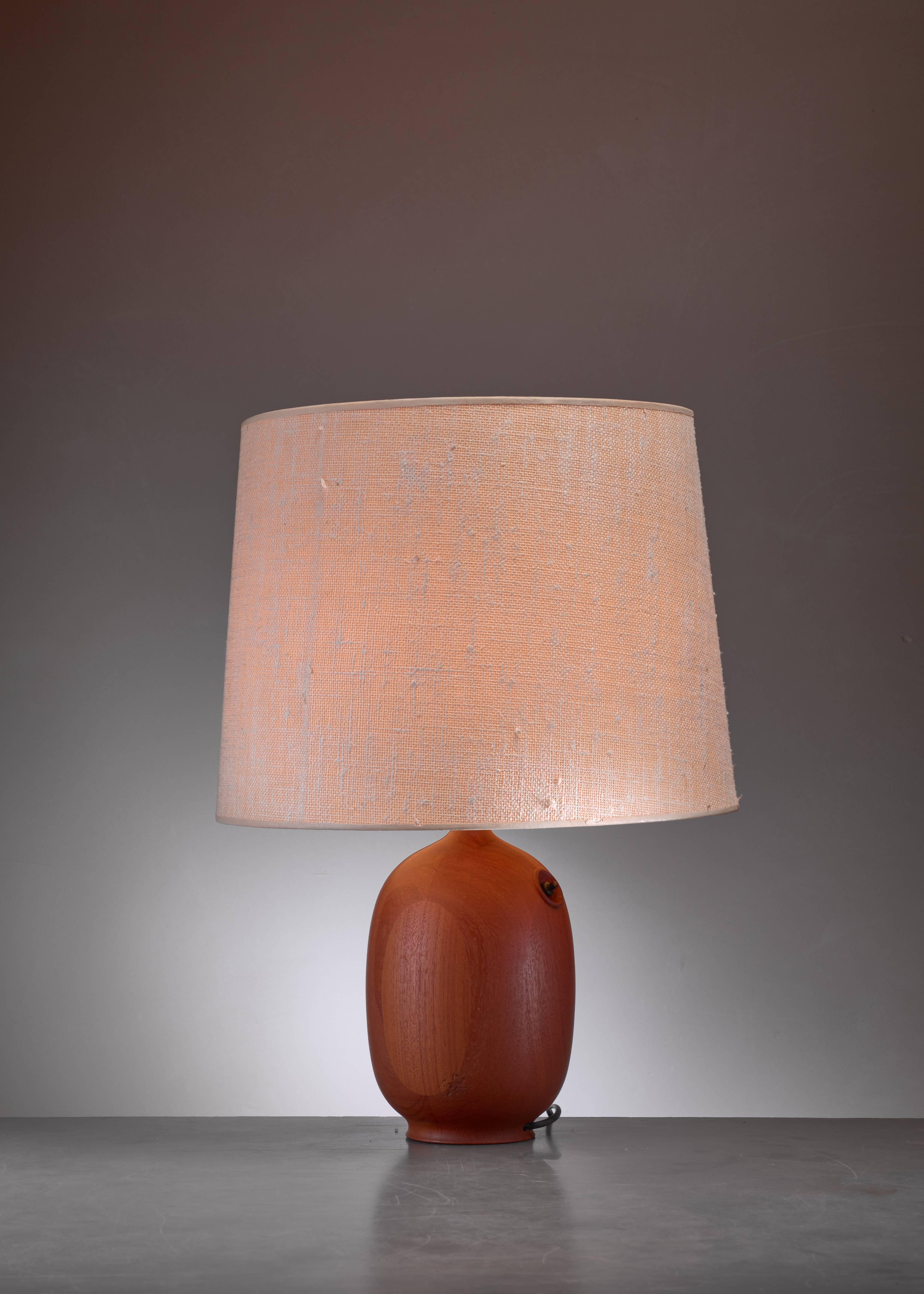 A Danish wooden based table lamp with newly made shade. The base has a slight oval shape and is in a wonderful condition. The measurements are of the lamp without a shade.

* This piece is offered to you by Bloomberry, Amsterdam *