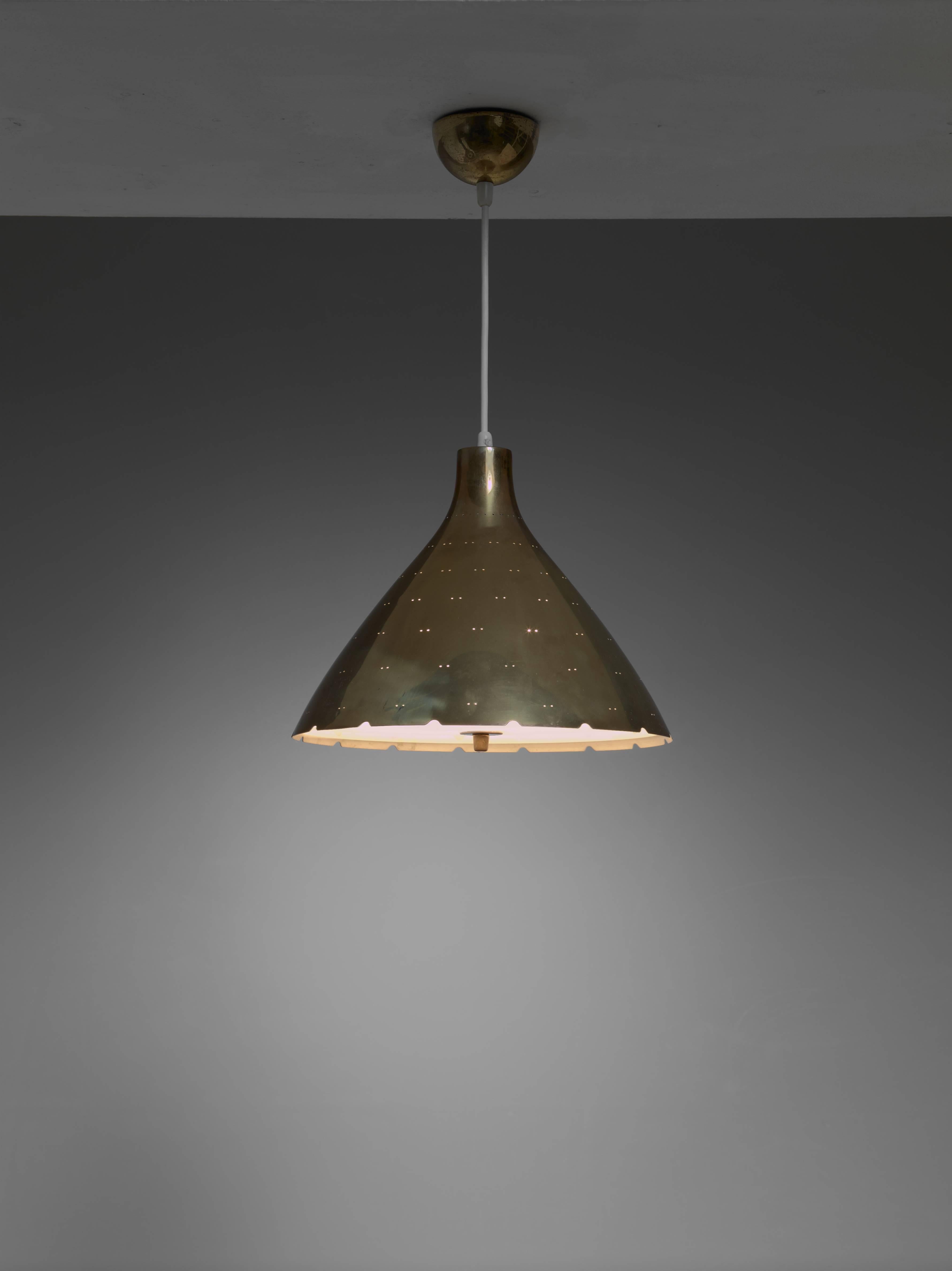 Large edition of the K2-46 chandelier by Paavo Tynell for Idman. The brass hood has twin dot perforations and a glass difusser underneath.

The lamp holds one E27 light bulb and we can adjust the total drop to your requirements.
      
* This piece