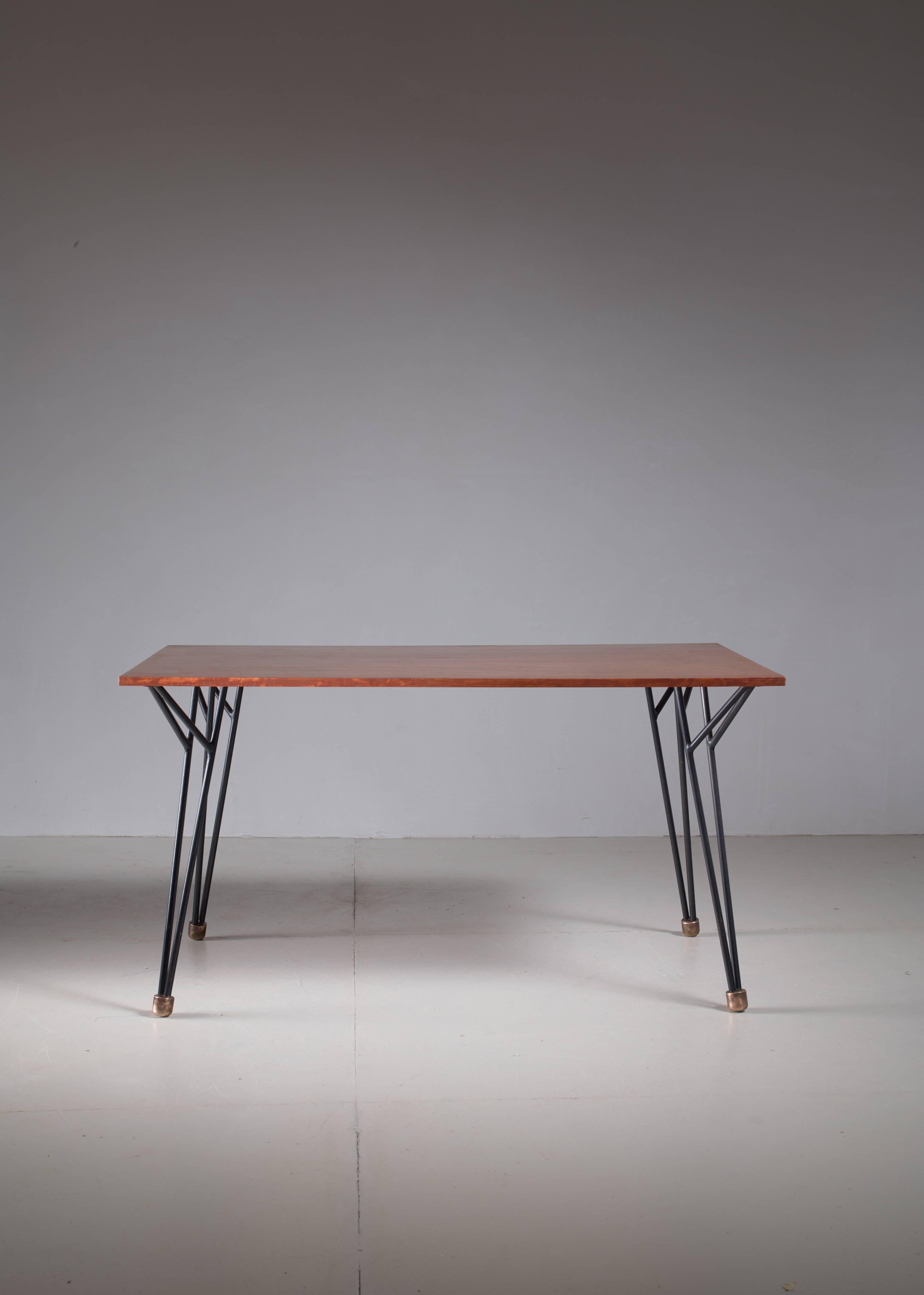 A rare Alfred Hendrickx work desk or dining table, designed circa 1958 and produced by Belform, Belgium. 

The top is made of wood with a root wood veneer and a frame of black tubular steel with massive brass feet. An extremely rare table and in