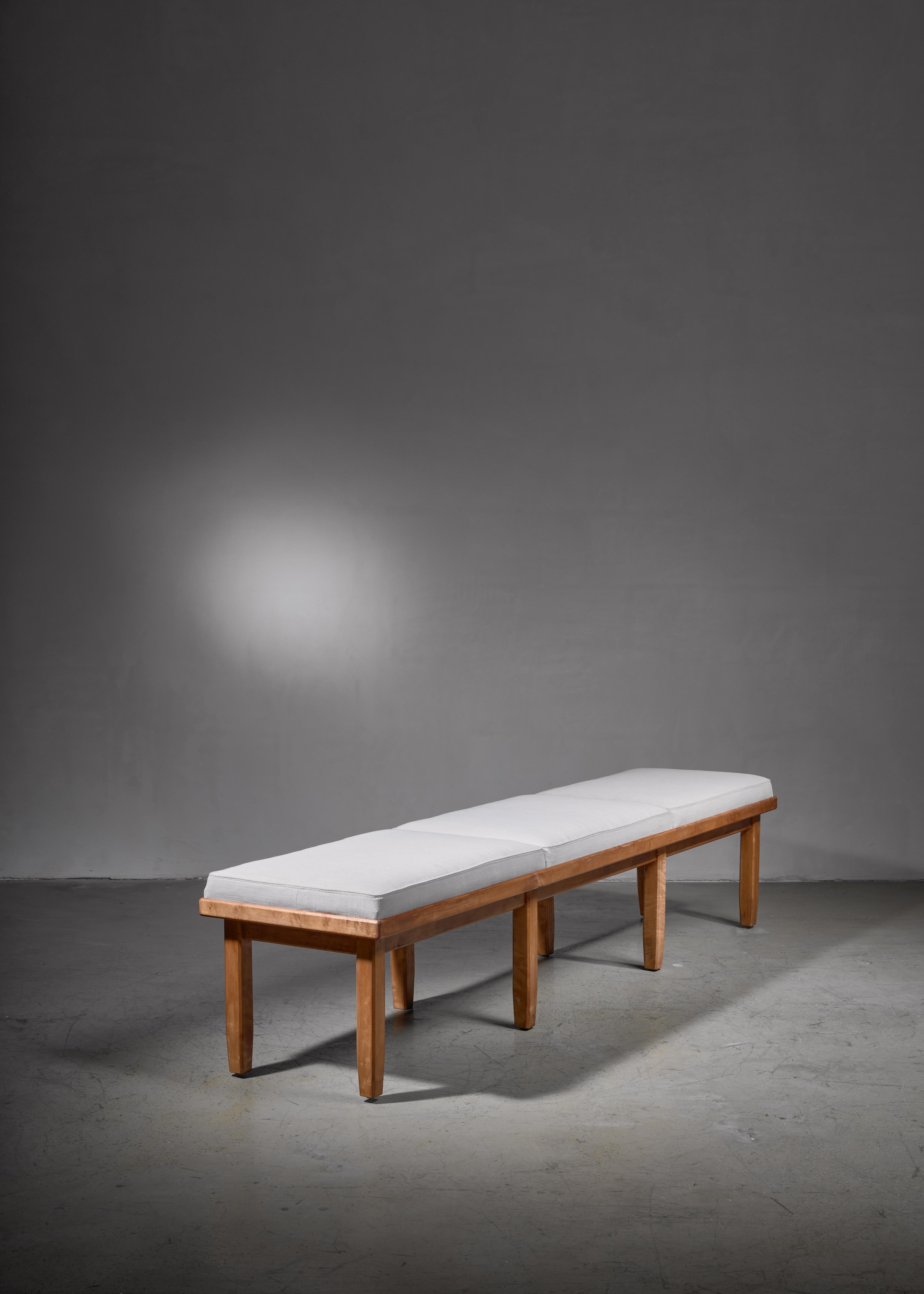A long bench in tiger or curly maple with three cushions, by Nordiska Kompaniet, Sweden. The cushions have been reupholstered with an off-white fabric in our in-house atelier.
Labeled by Nordiska with the production number R566109-C39054 and in a