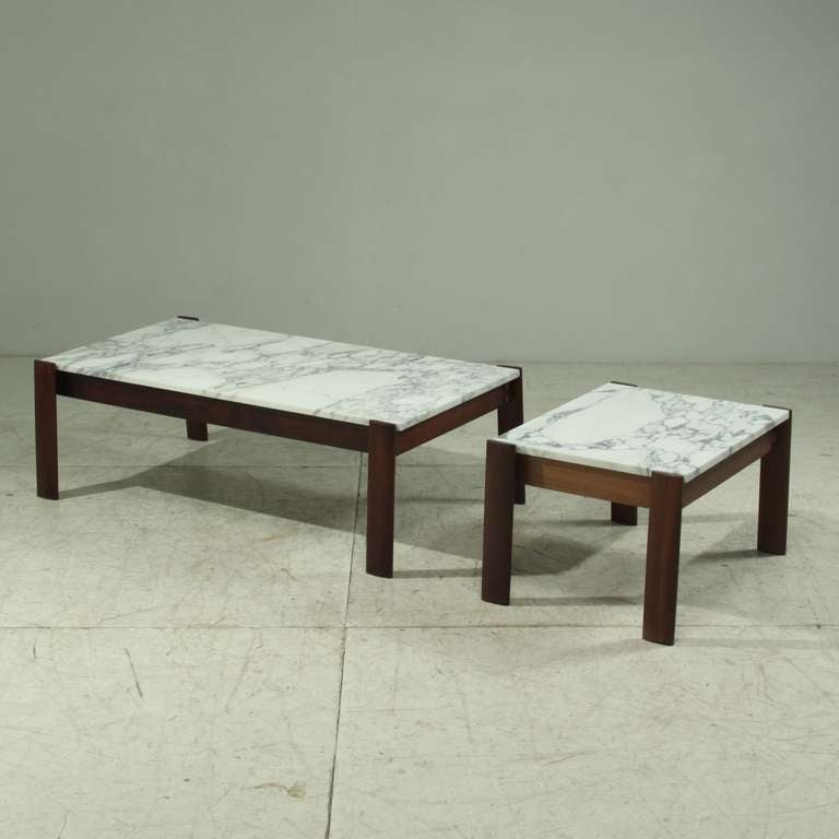 Two sidetables by Brazilian designer and apprentice of Sergio Rodrigues, Percival Lafer.

Both tables are a combination of a rosewood frame and a marble top.
Dimensions are:
Height: 65 cm
Width: 119.5 cm and 50.5 cm
Depth: 65 cm

*This set is