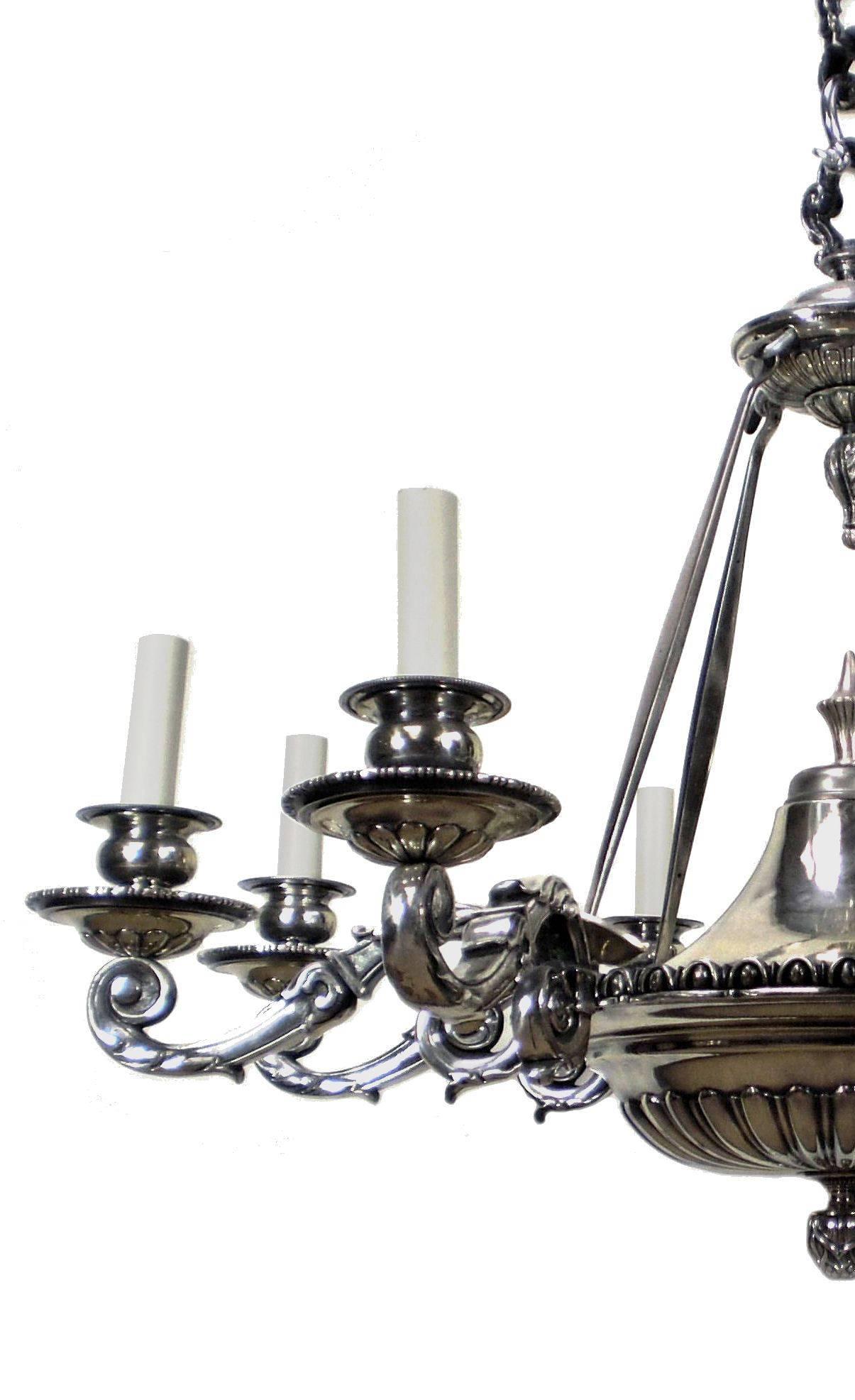 A large and impressive English six branch Charles II style chandelier in silver plated bronze.
 