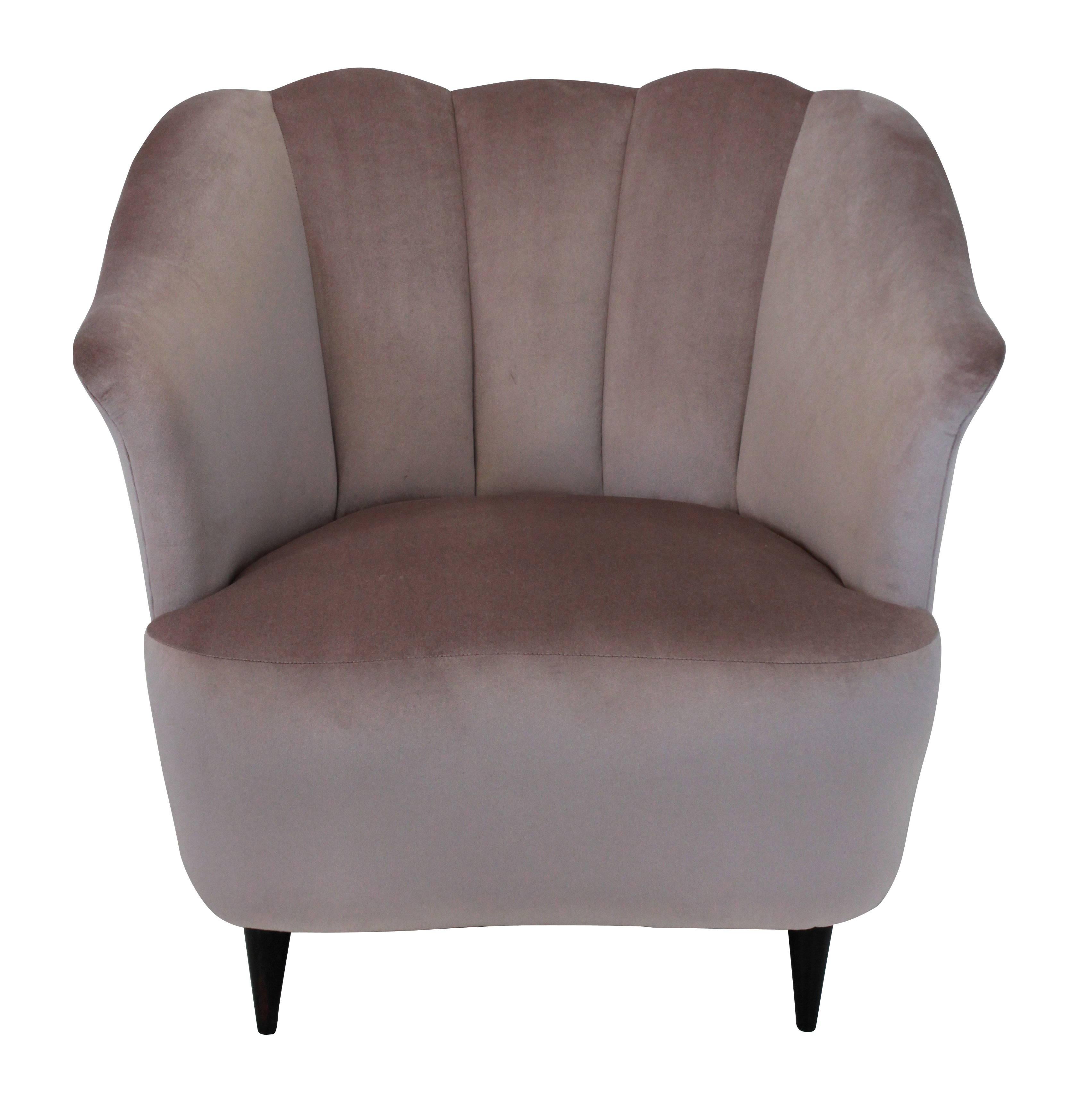 A pair of Italian scallop backed armchairs, newly upholstered in pale pink velvet.