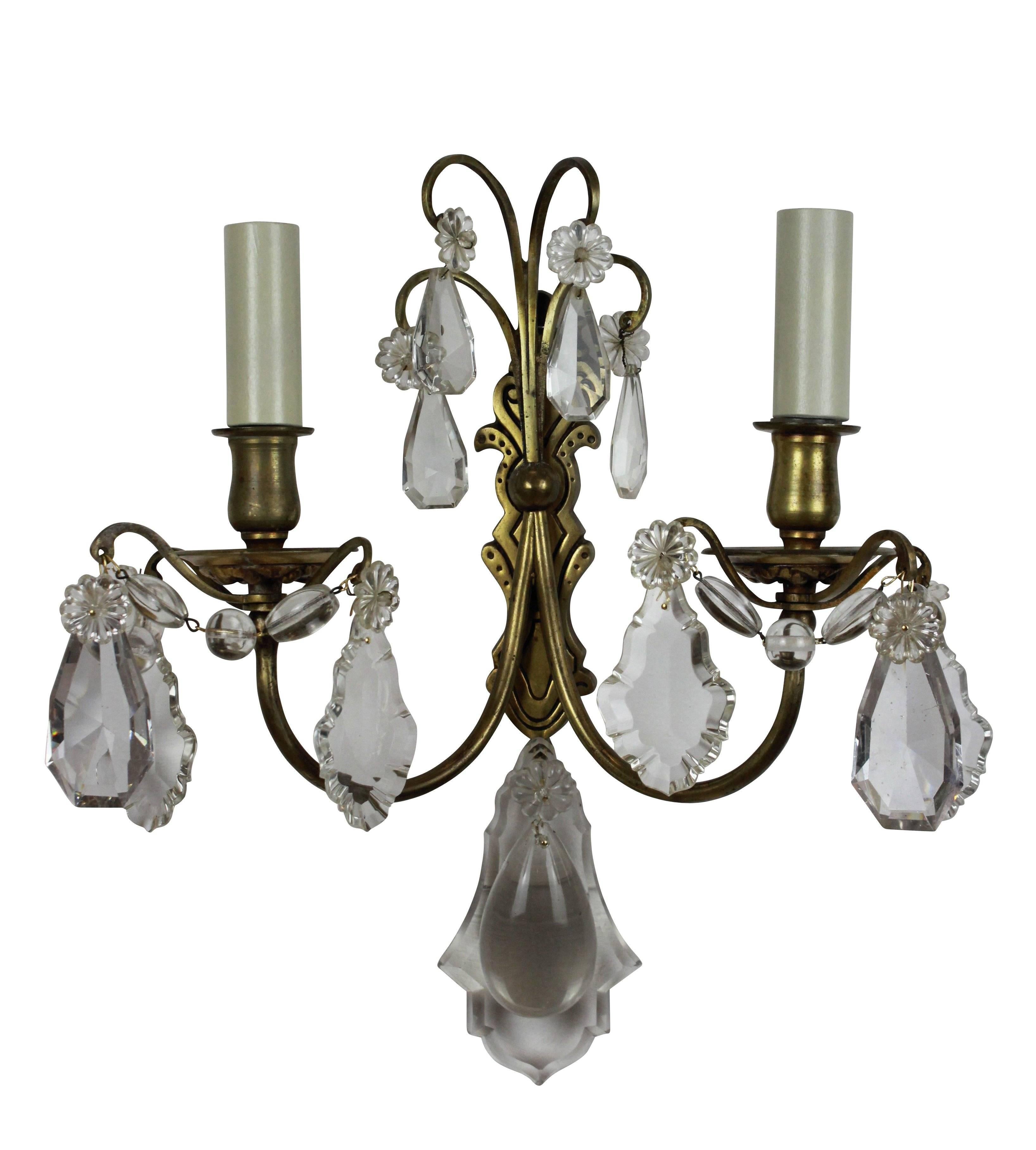 A set of six French twin-branch wall sconces in gilt brass with cut-glass drops.
 