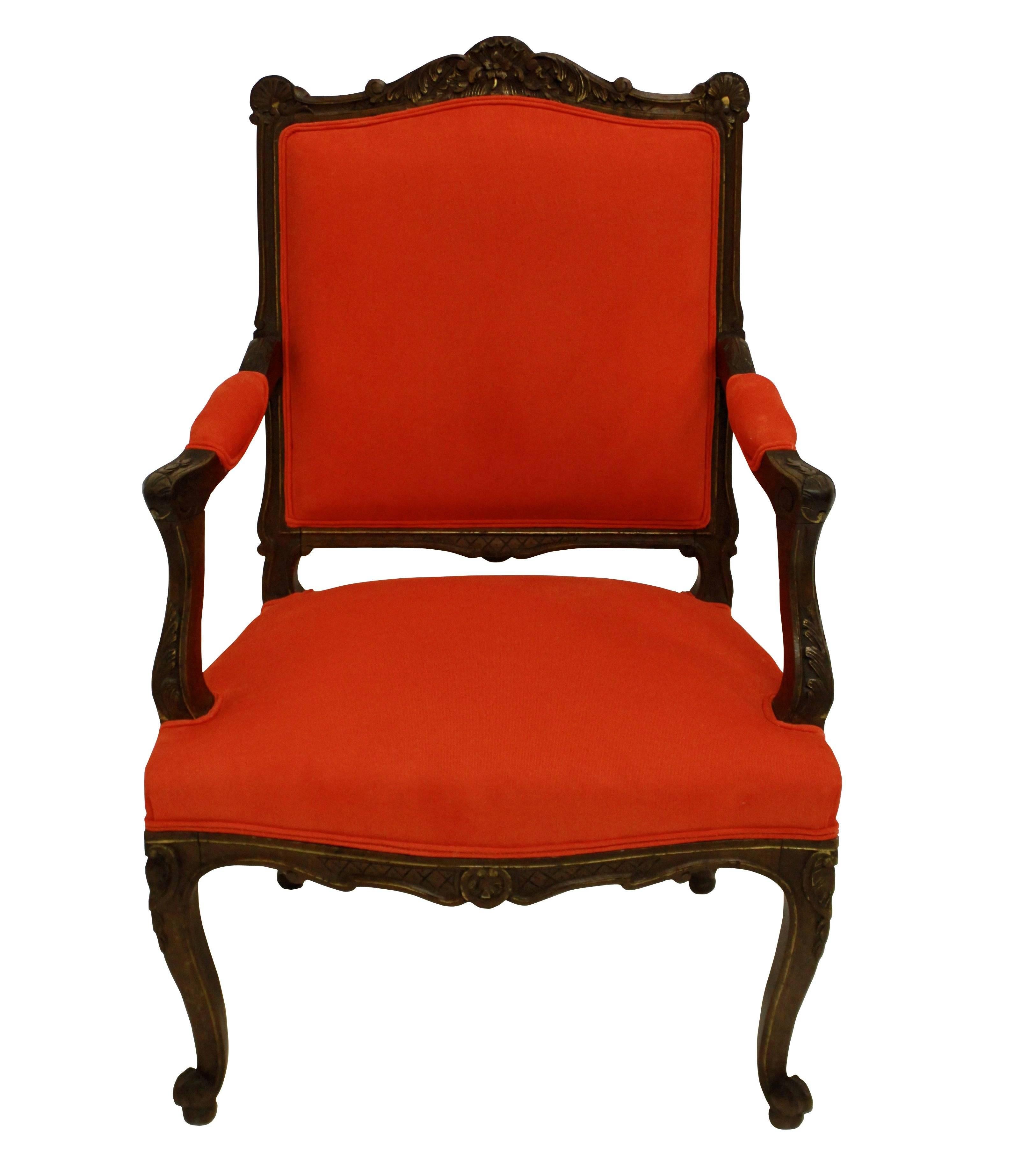 A pair of French Louis XV style walnut armchairs, beautifully carved with highlighted gilding in places, newly upholstered in blood orange corduroy.

Measure: 100cm high (backs) x 43cm high (seats) x 64cm wide x 50cm deep