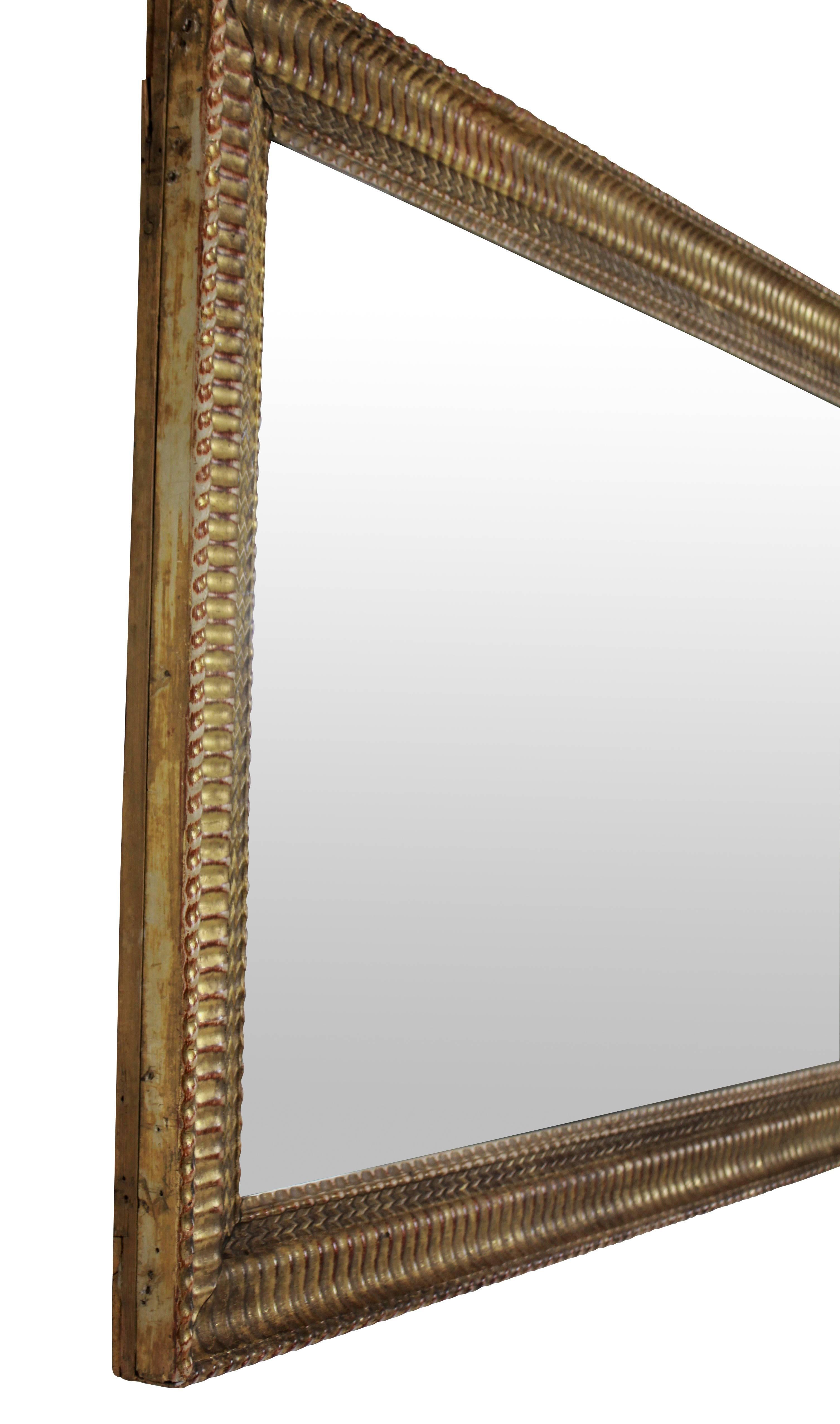 An English giltwood mirror with its original mercury plate.

 