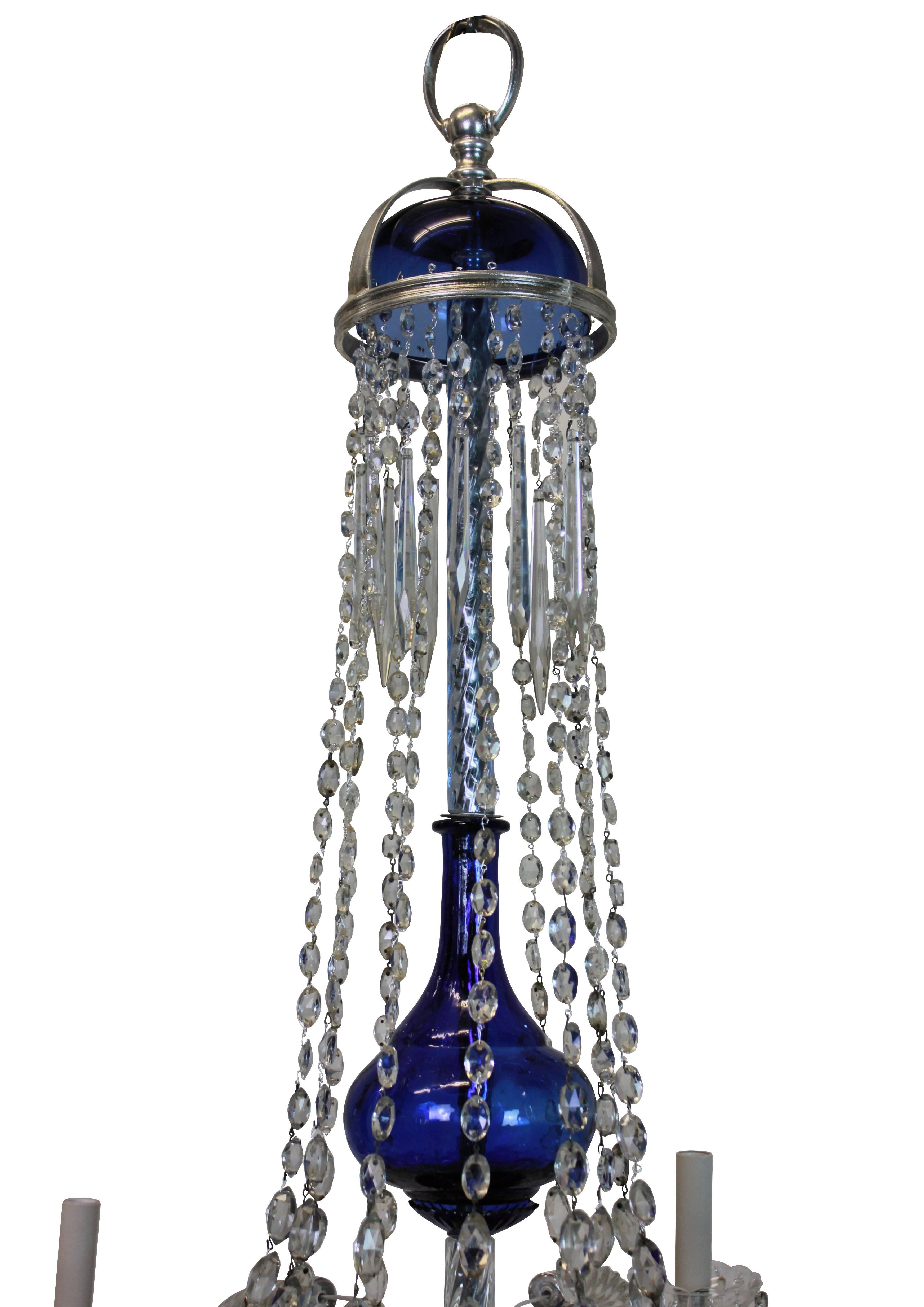 A fine Baltic chandelier with 'Baltic' blue glass and clear cut-glass dressings, arms and pendants. The metal work of silver plate. Six arms in total.

 