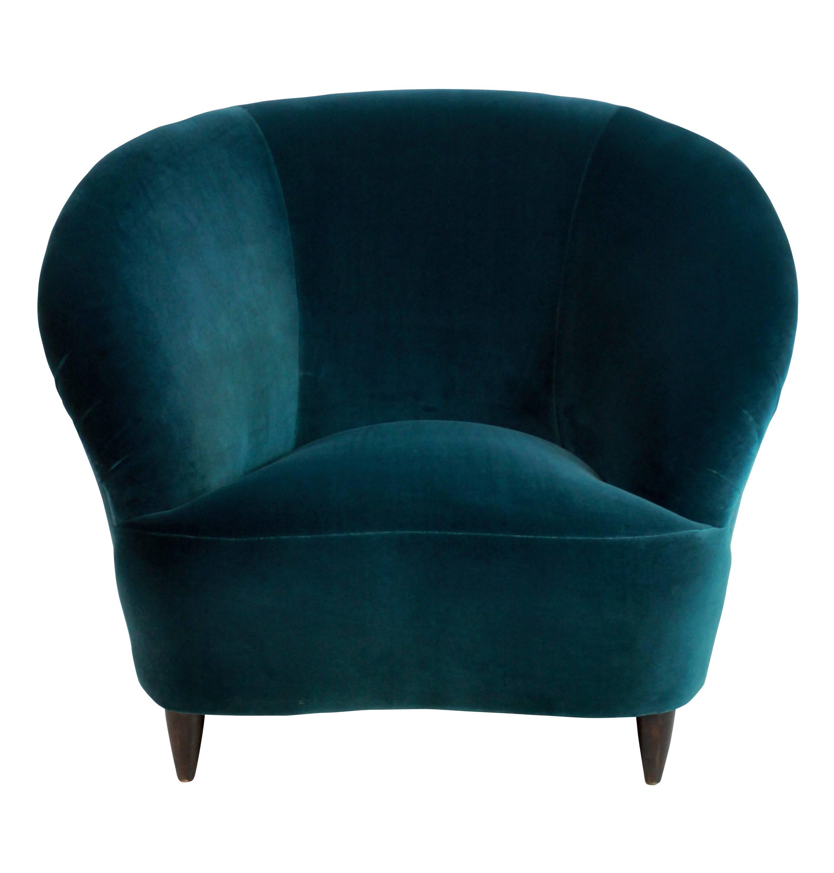 A pair of large Italian sculptural lounge chairs by Parisi. On turned French polished legs. Photographed here in teal velvet but can be upholstered in a fabric of your choice.

 