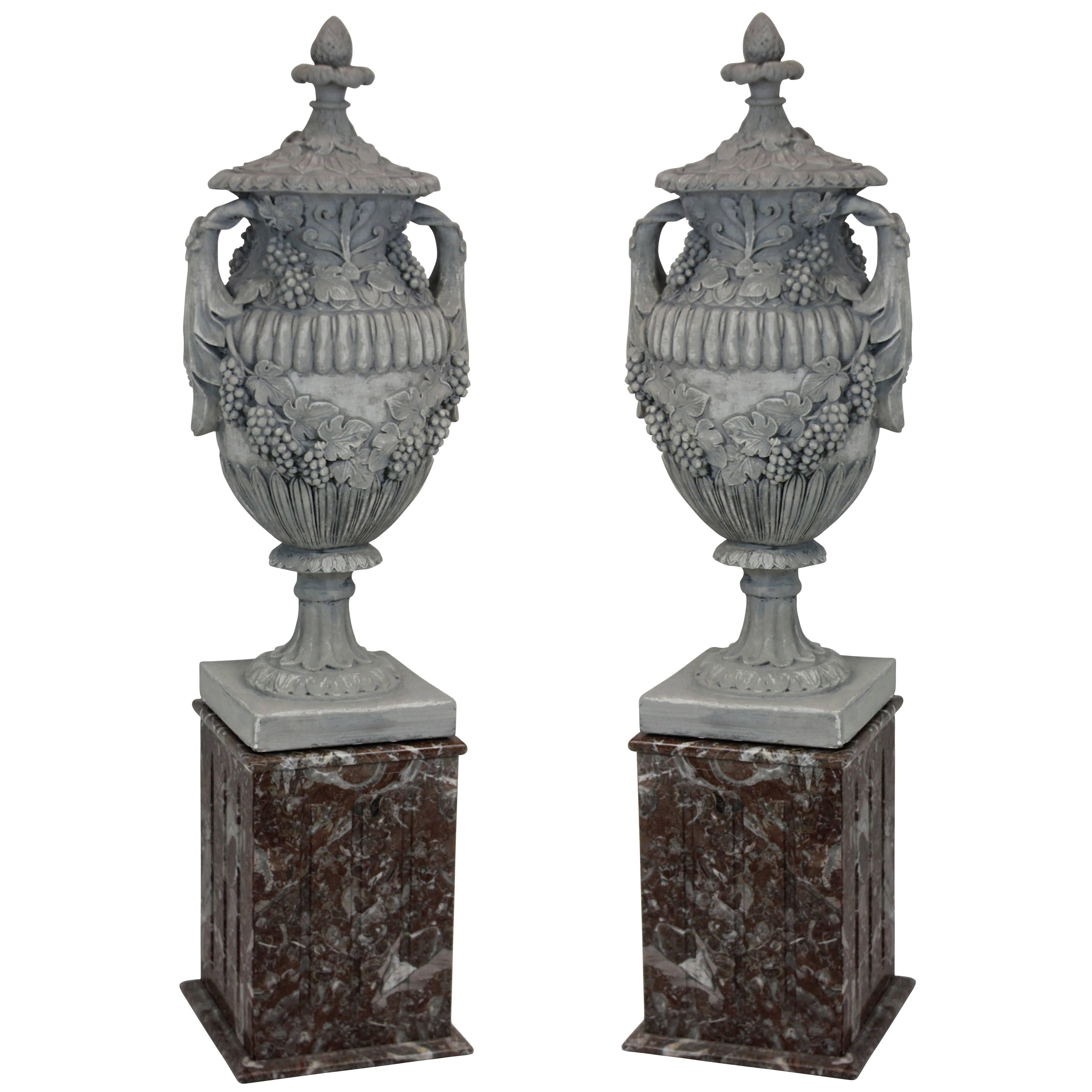 Pair of Large Plaster Urns on Marble Plinths