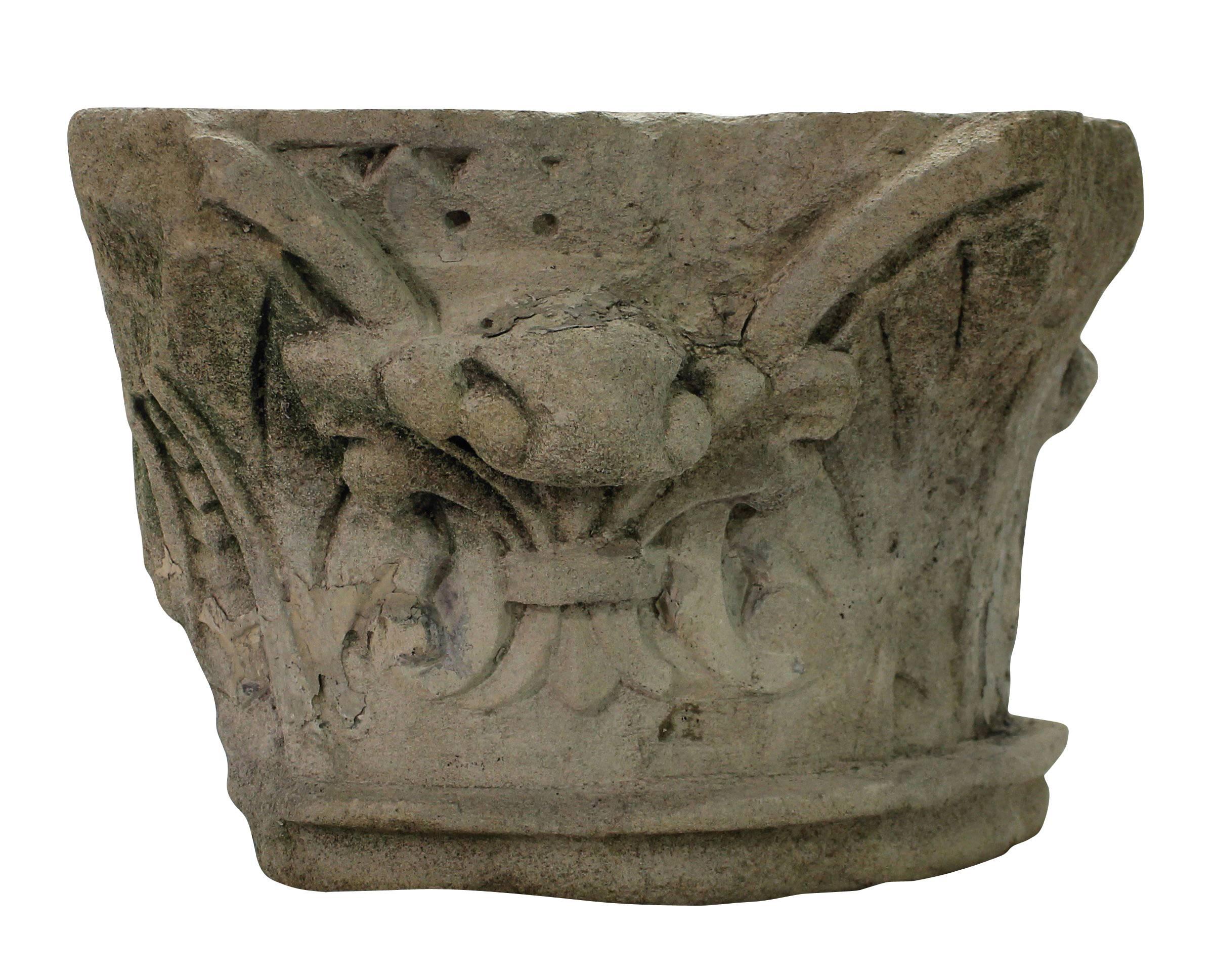 A pair of English classically carved limestone architectural fragments depicting acanthus with traces of paint.
  