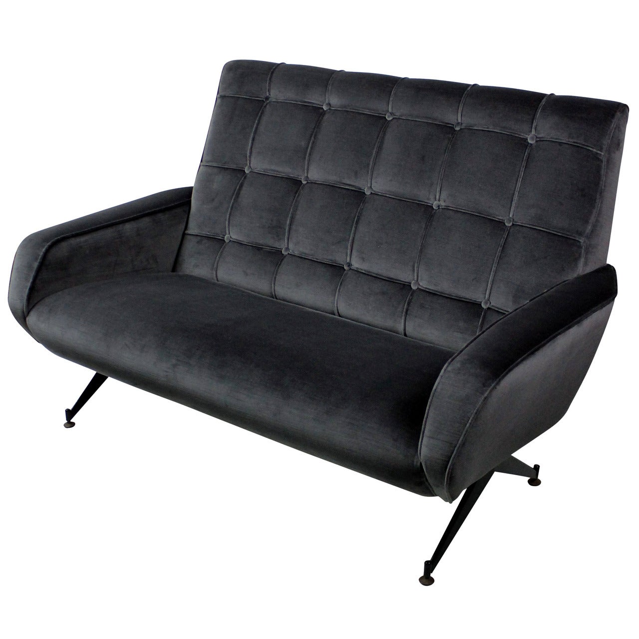 An Italian two-seat settee in the style of Arflex, with detailed buttoned back and angular shape, supported on black enameled legs. Newly upholstered in a ribbed blue or grey velvet.