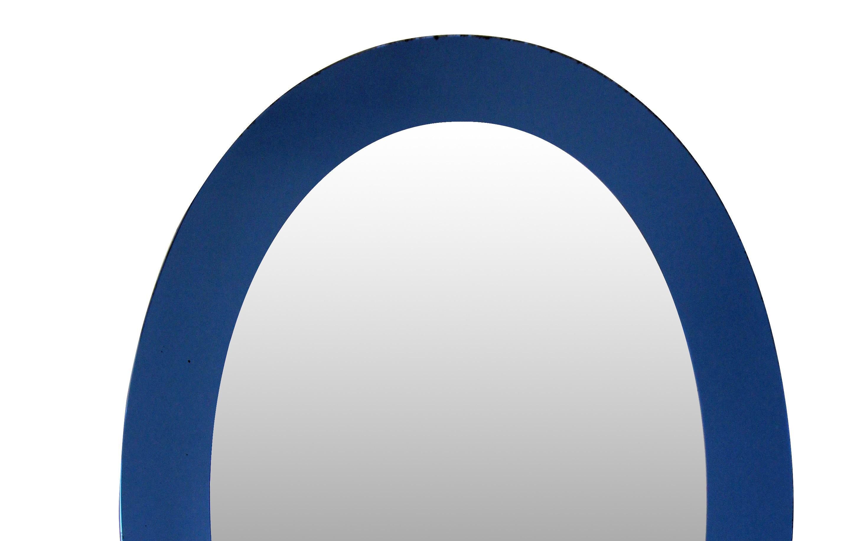 An Italian oval mirror with a blue border.