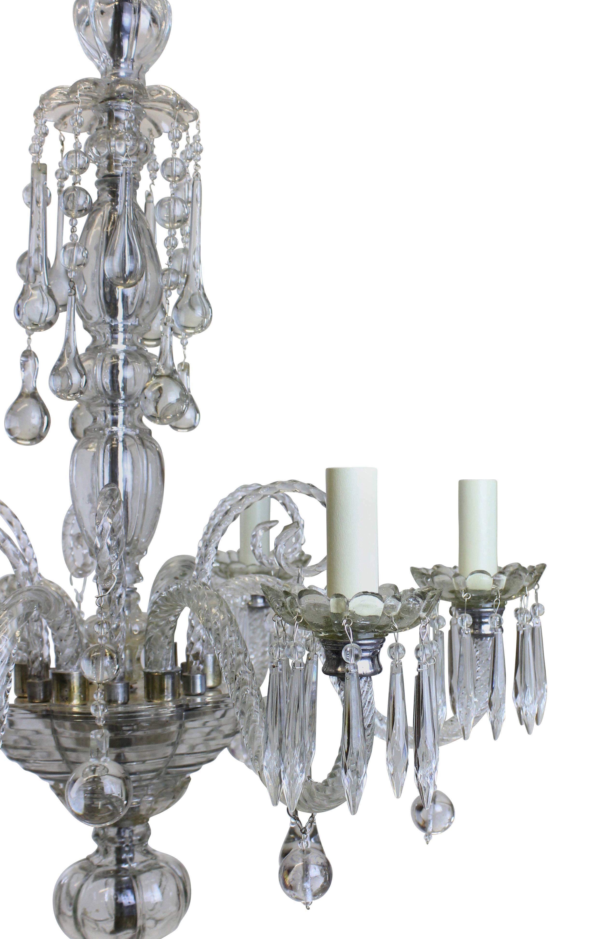 A French moulded glass traditional chandelier with swags and balls.