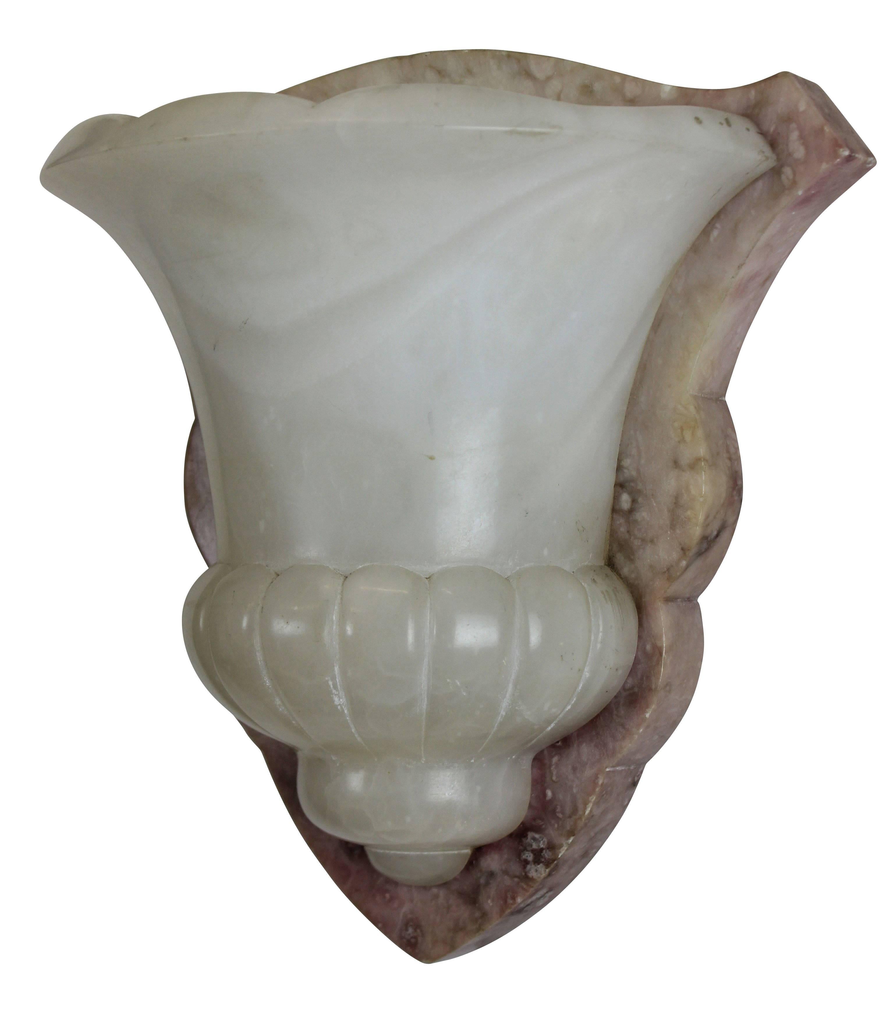 A pair of French alabaster wall sconces. Of shield shape in two colors.