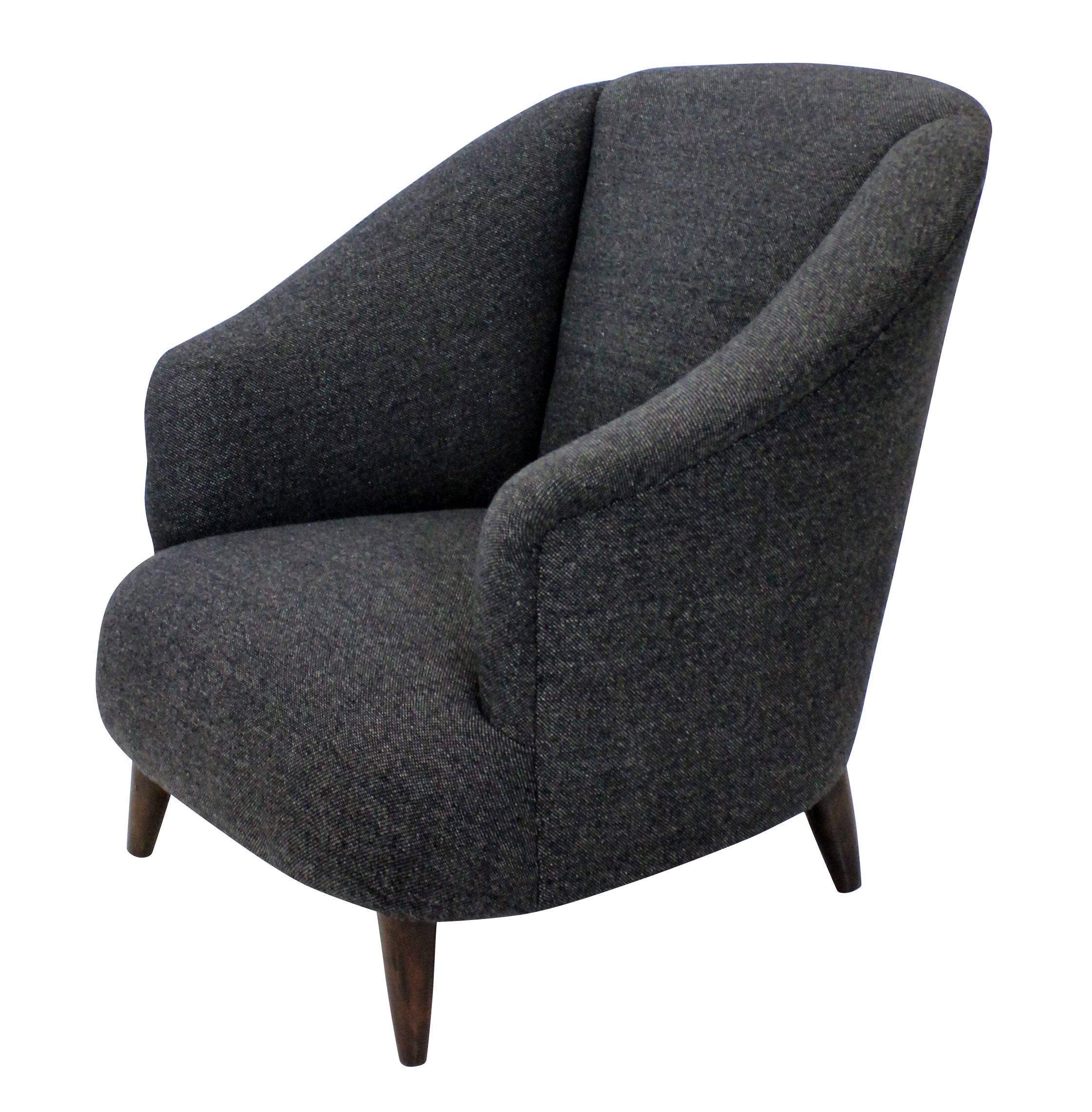 A pair of generous scale sculptural armchairs by Ulrich. Newly upholstered in dark grey wool.