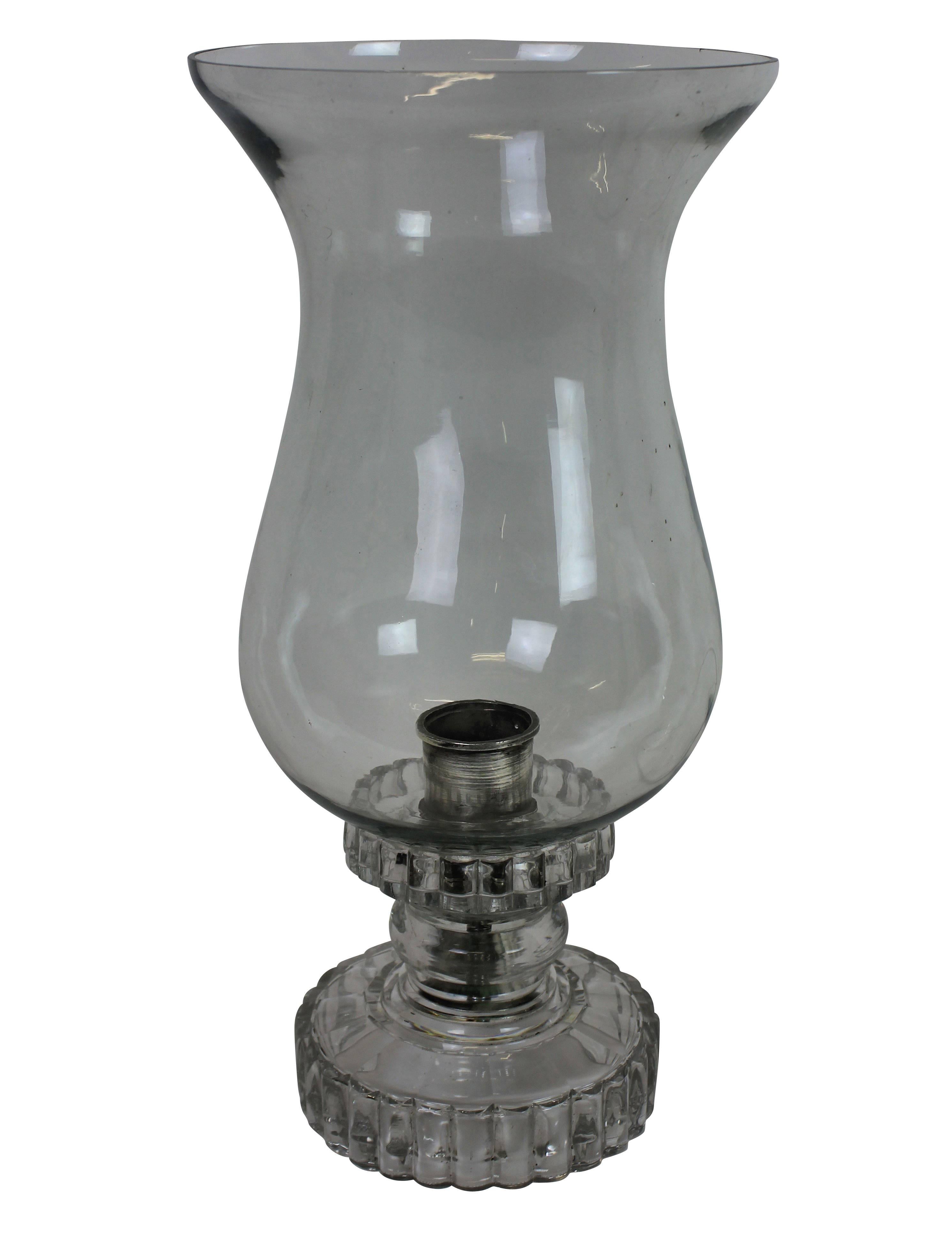 A large English George IV hurricane lamp. With a cut-glass base, silver plated candle fitting and large handblown shade.
 
