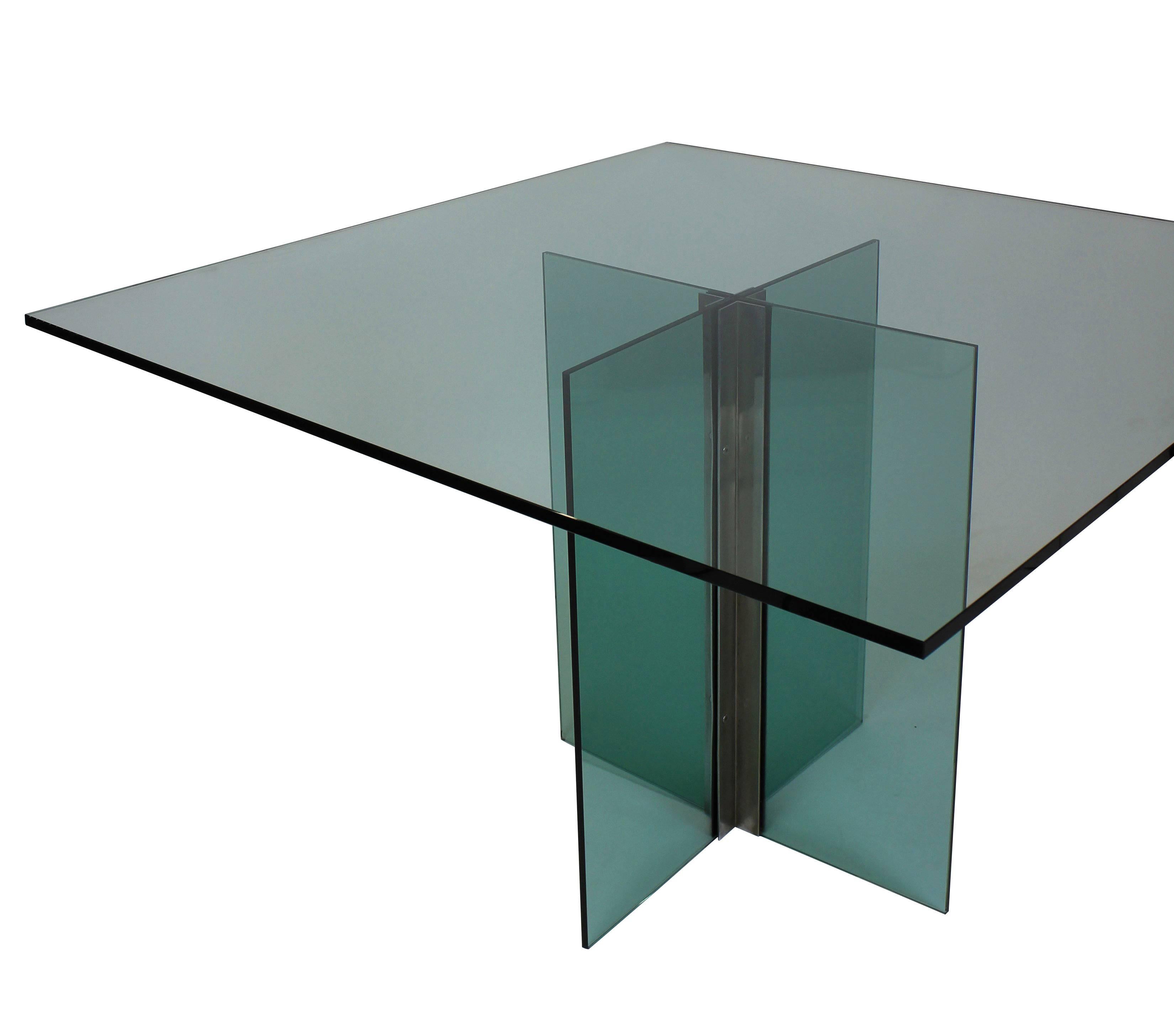 An Italian dining table in the manner of Fontana Arte, comprising green tinted glass and chrome, this table seats eight.
 