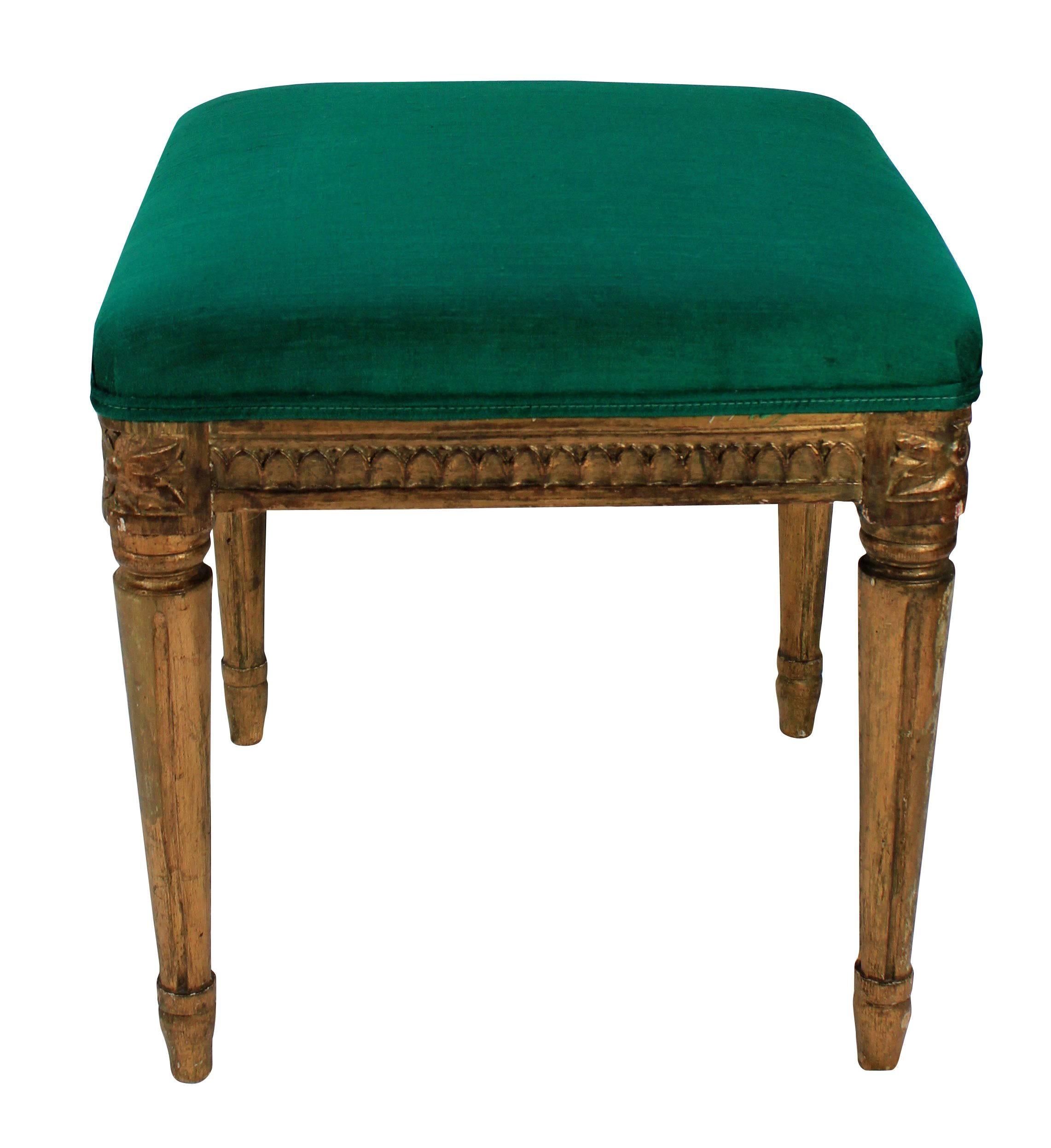 A Swedish giltwood stool, upholstered in emerald silk.