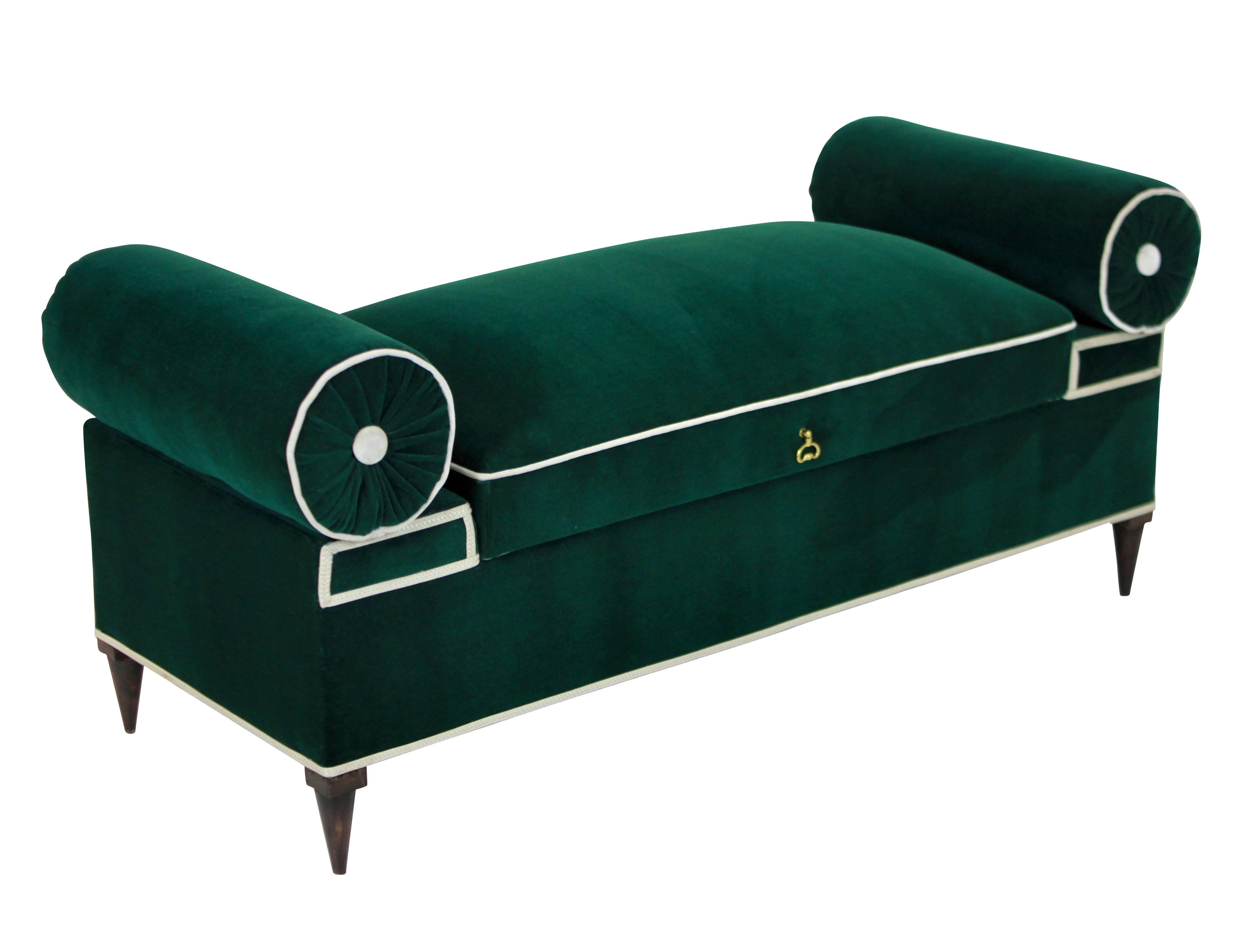 A large Italian ottoman or window seat of elegant design and proportions. In emerald green velvet with cream detail. On tapering legs and newly upholstered inside.
 