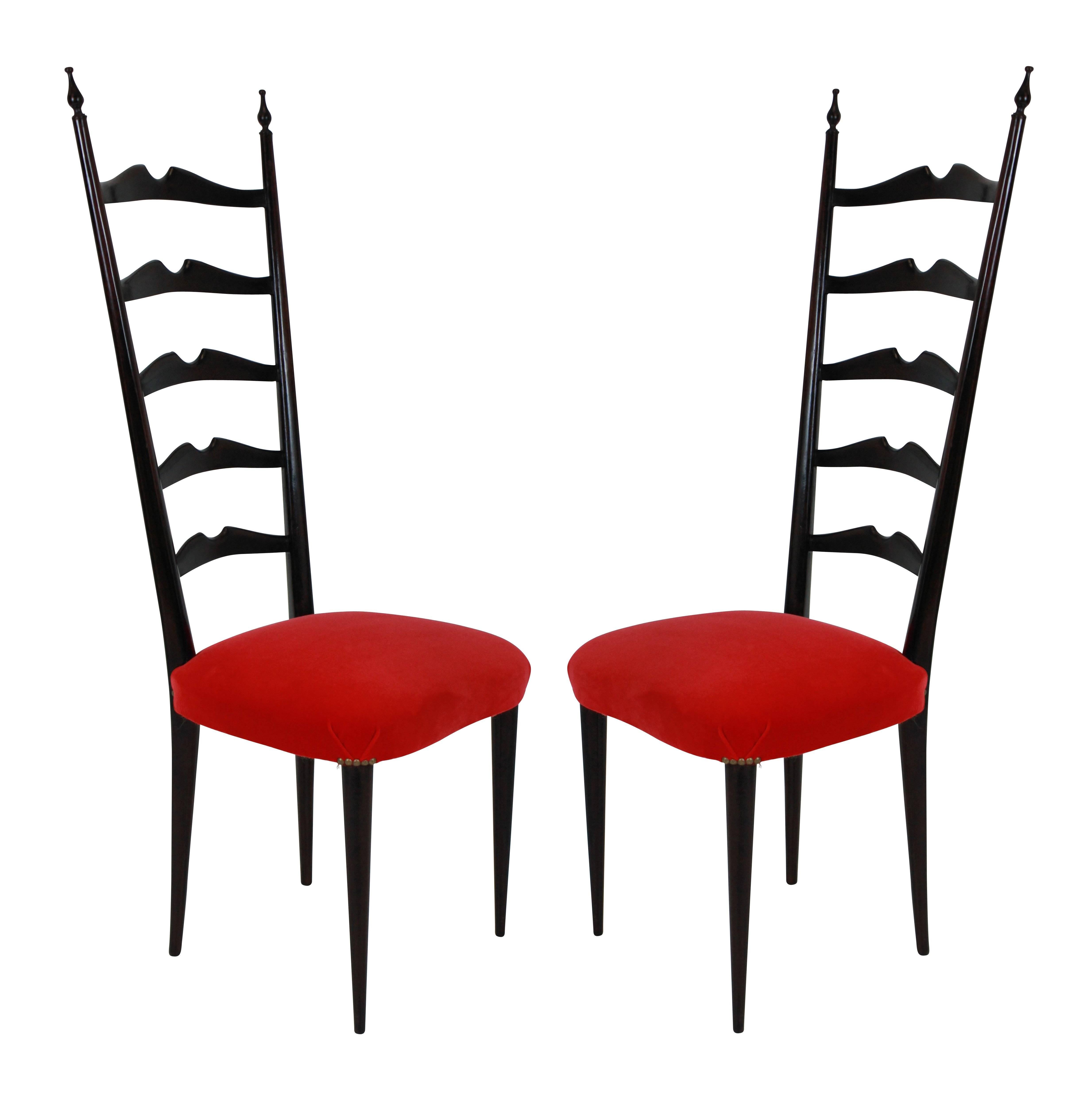 A set of four elegant curved ladder back hall chairs by Paolo Buffa. Newly upholstered in scarlet velvet.
    