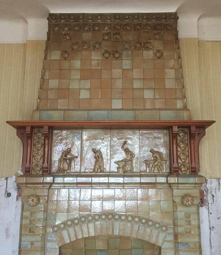This rare and exceptional antique fireplace wad made out of ceramic by Charles Gréber from the Gréber Manufacture circa 1910. 
The central frieze is decorated with four scenes showing men at work : a carpenter, a locksmith and a forgeron. 
The