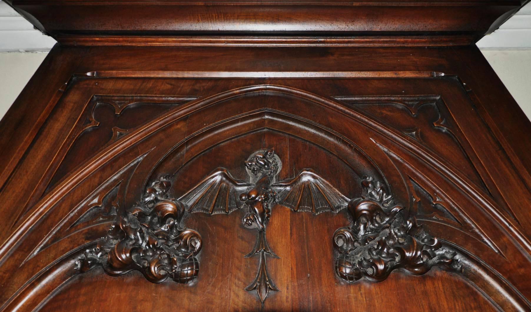 French Neo-Gothic style carved walnut fireplace with hood, 19th c. For Sale