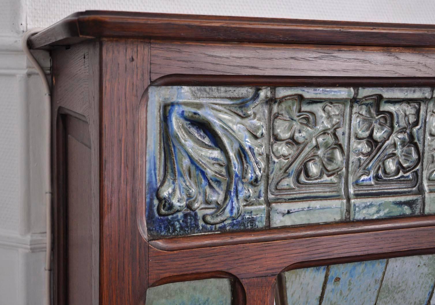 Carved Art Nouveau Fireplace Attributed to Gentil & Bourdet Manufacture Oak and Ceramic