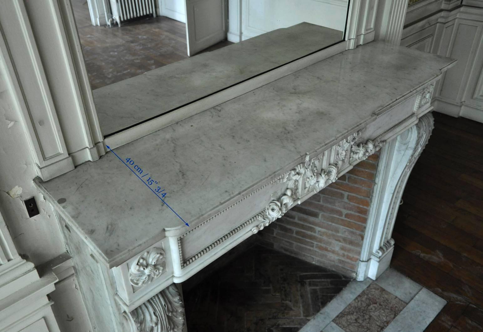 Louis XVI Style Fireplace in White Carrara Marble with Carved Garland of Flowers 4