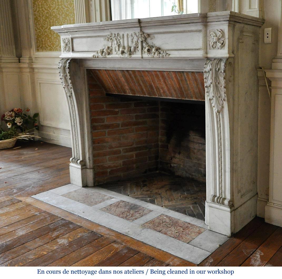 19th Century Louis XVI Style Fireplace in White Carrara Marble with Carved Garland of Flowers