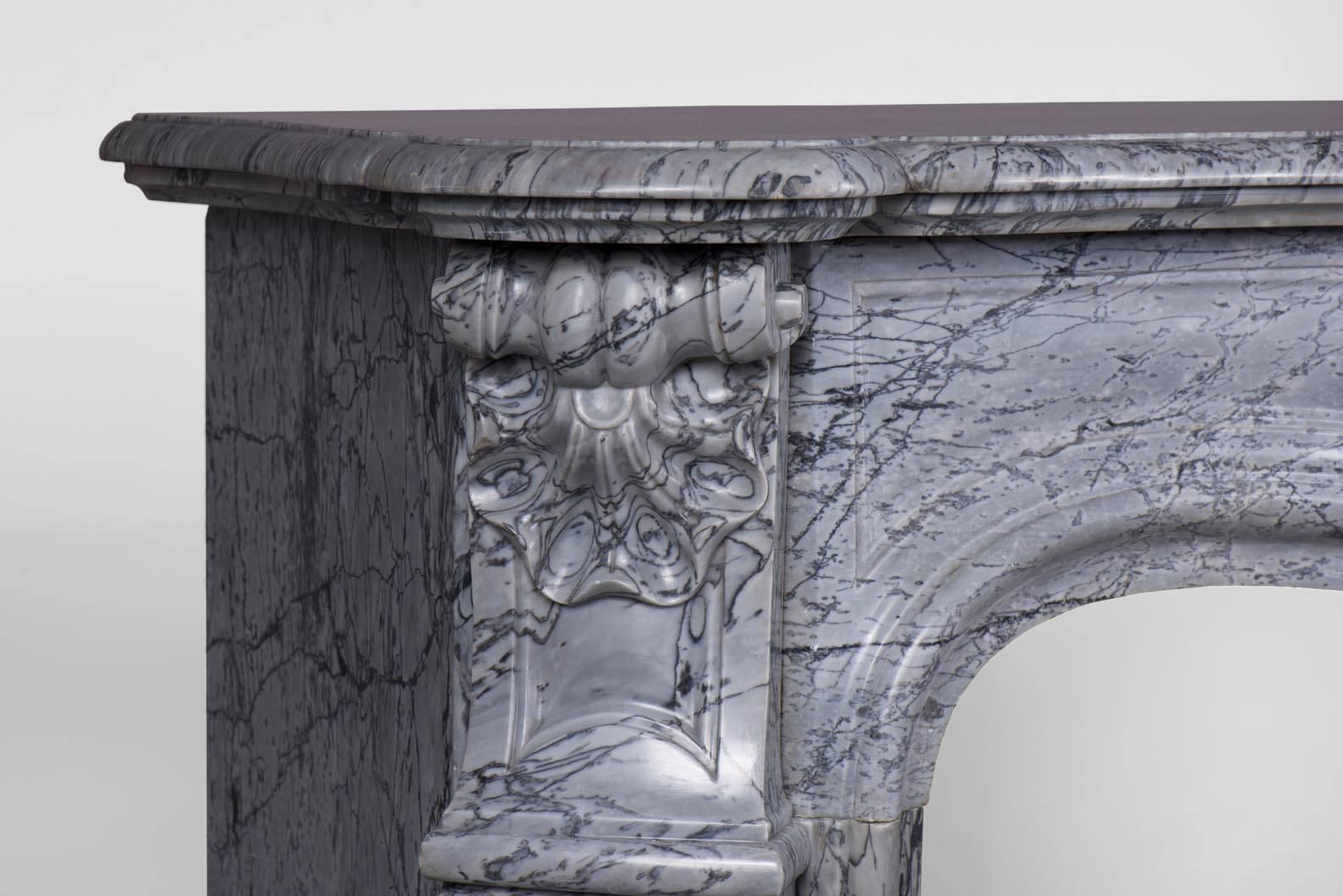 Antique Louis XV Style Fireplace, in Bleu Fleuri Marble, with Three Shells Decor In Good Condition For Sale In Saint Ouen, FR