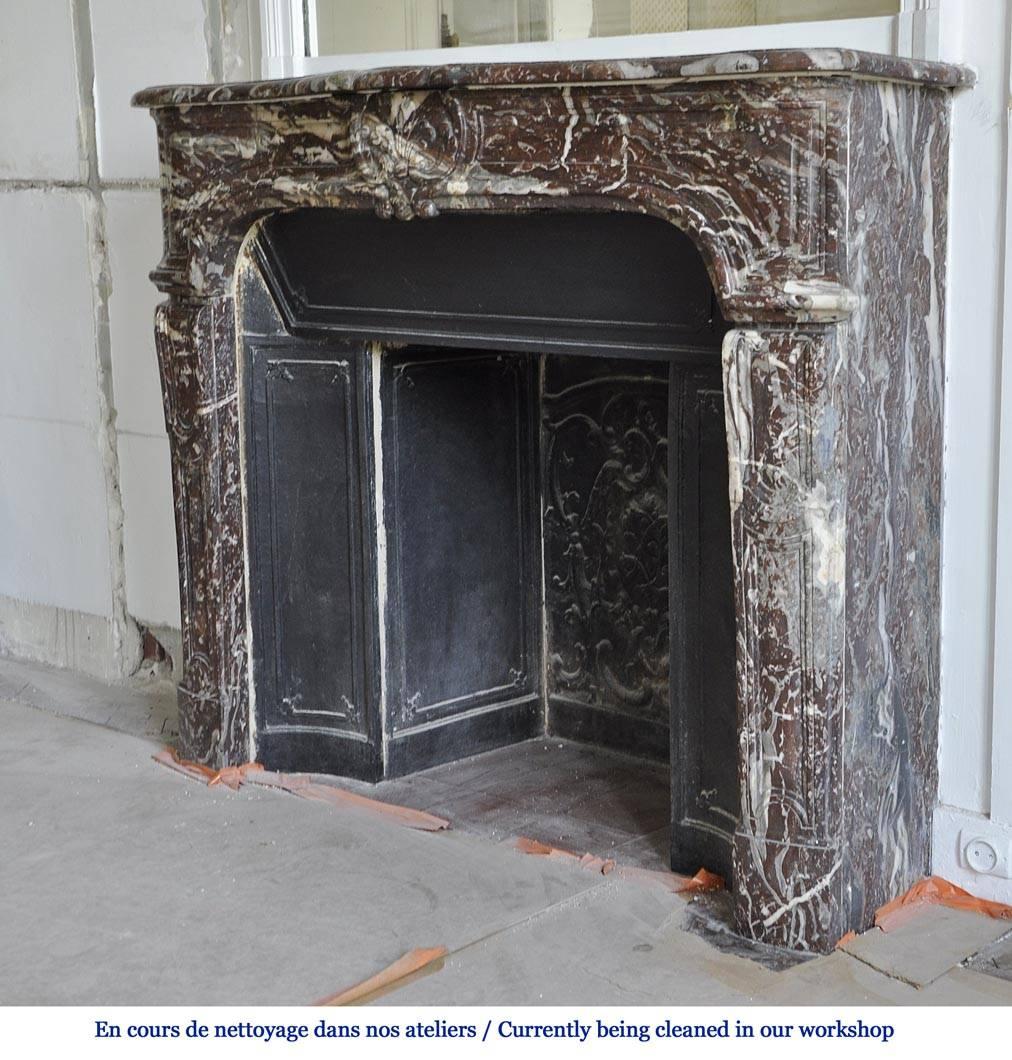 Carved Antique Regence Period Fireplace in Royal Red Marble with its Complete Cast Iron For Sale