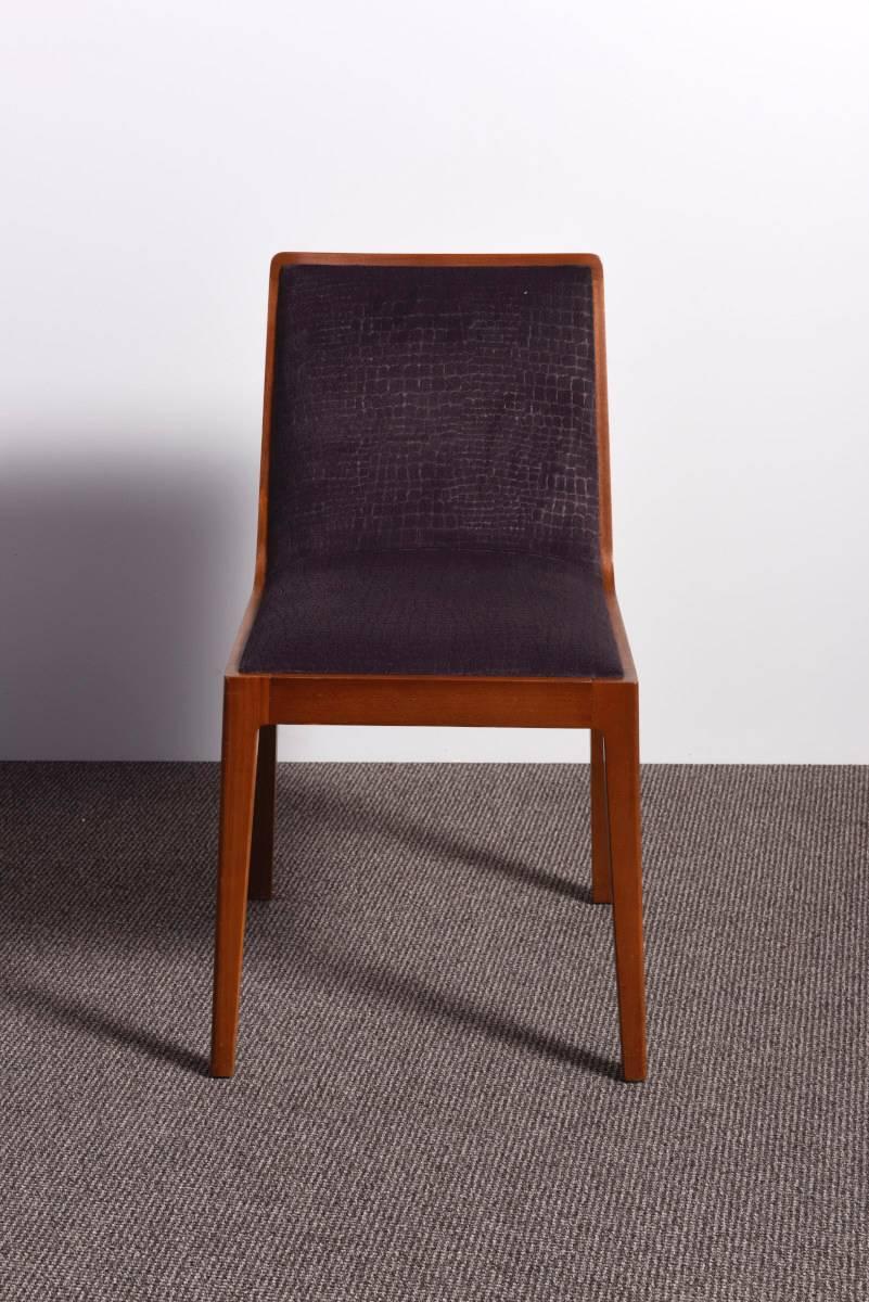 A very elegant set of four 1950s dining chairs in solid mahogany. They were recently restored, repolished and reupholstered with a dark brown colored velvet fabric.
Their elegant design permets them to be matched as well with an Art Deco or as with