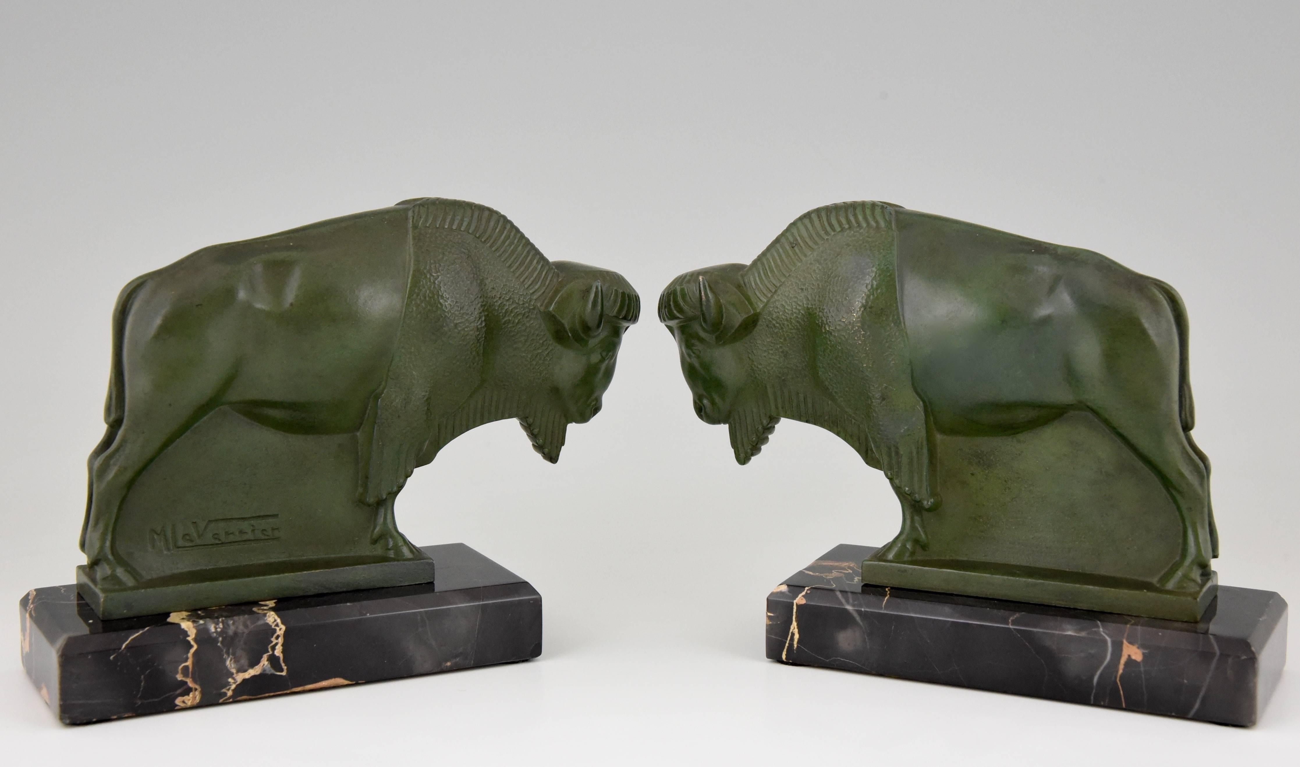 Art Deco bison bookends

Artist/Maker:
Max Le Verrier. 

Signature/Marks: 
M. Le Verrier. 

Style:
Art Deco.

Date:
1930.

Material: 
Green patinated metal.
Portor marble bases.

Origin: 
France.

Size of one:
H. 13.5 cm. x L.