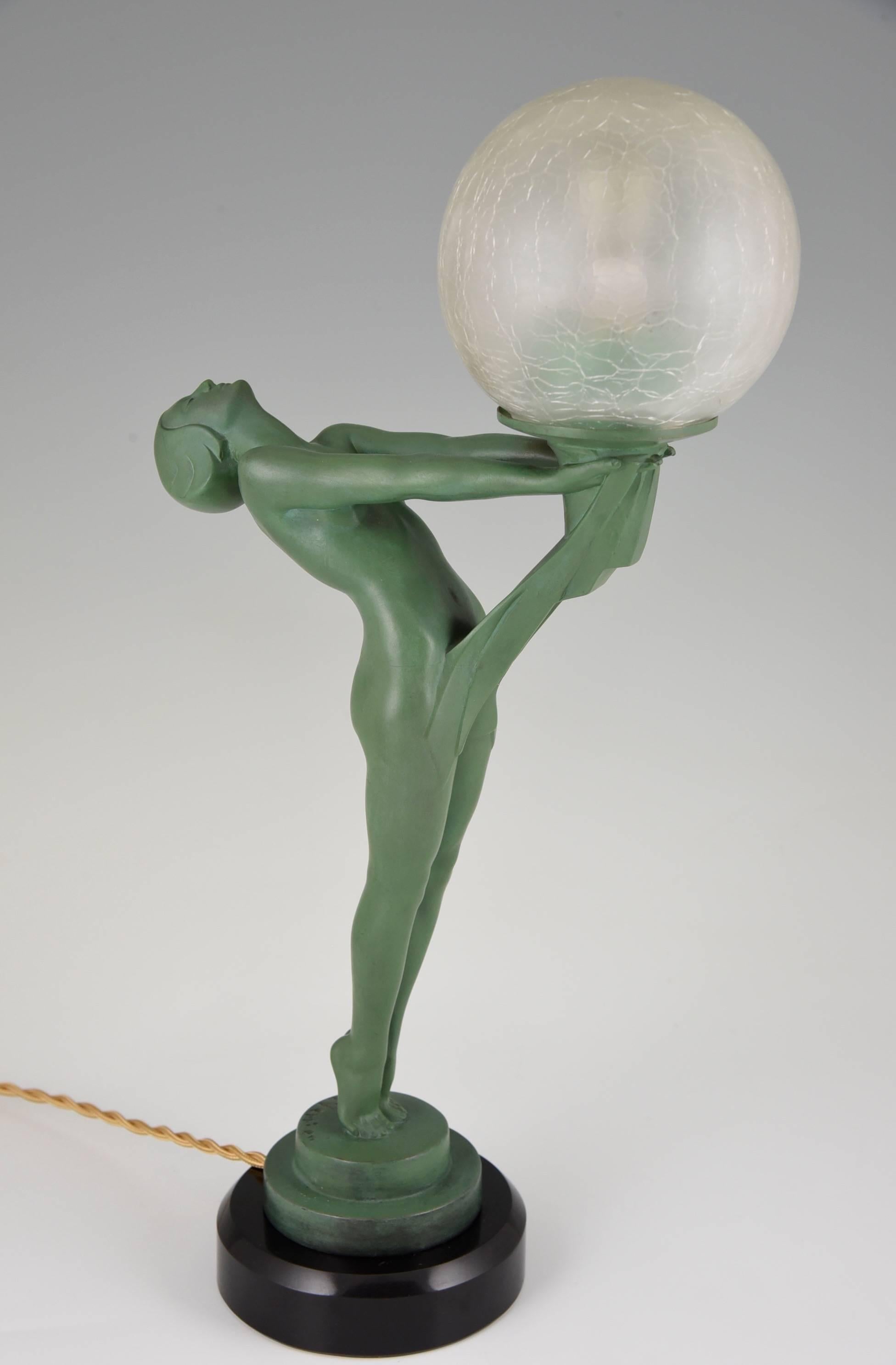 Patinated French Art Deco Lamp Nude Holding a Globe by Max Le Verrier, 1930