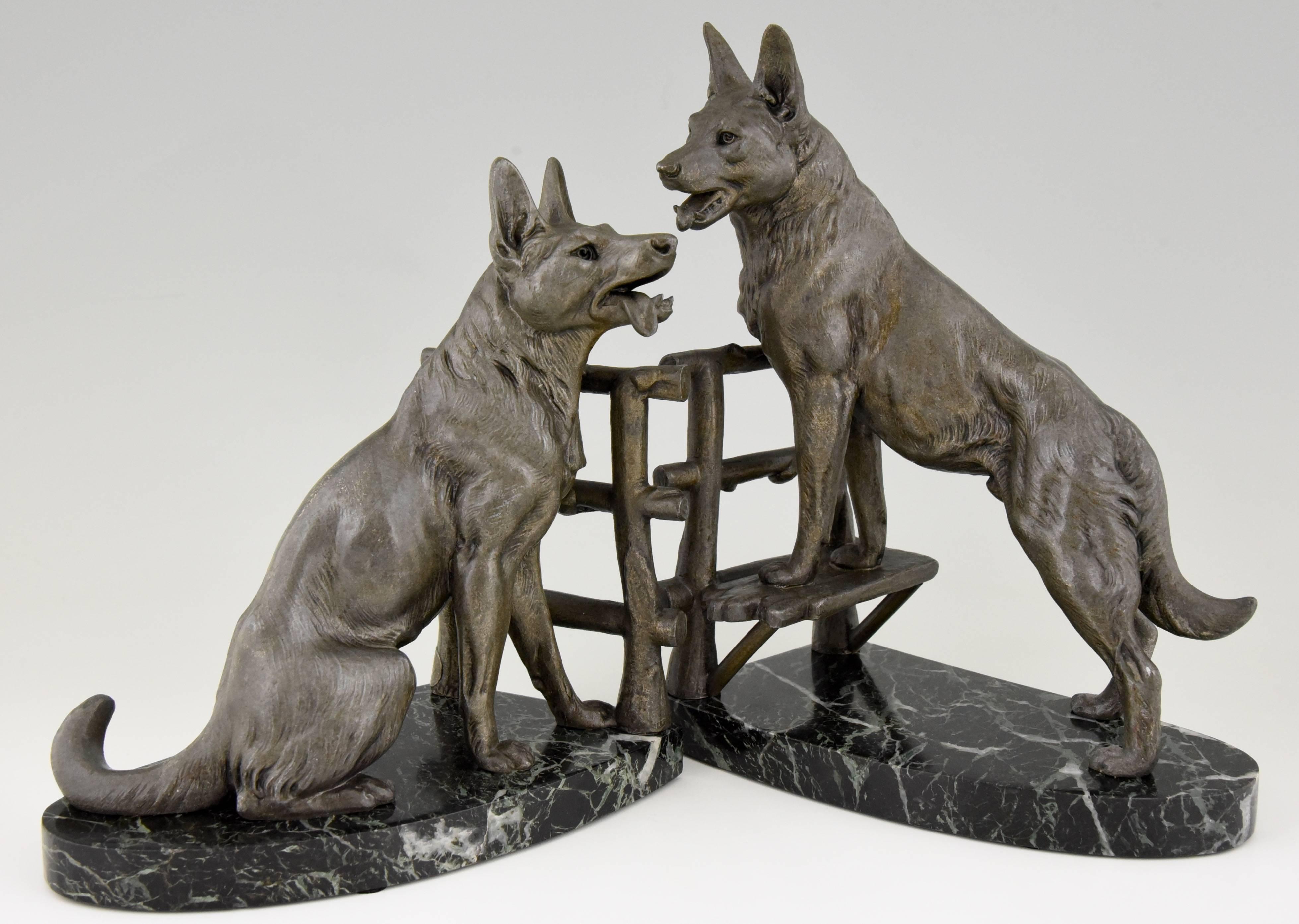 Description:  Art Deco German shepherd bookends. 
Artist/ Maker:  Louis Albert Carvin.
Signature/ Marks:  Unsigned.  Foundry mark.   Style:  Art Deco. 
Date:  1930. 
Material: Patinated metal.  Green marble base.
Origin:  France. 
Size of one: