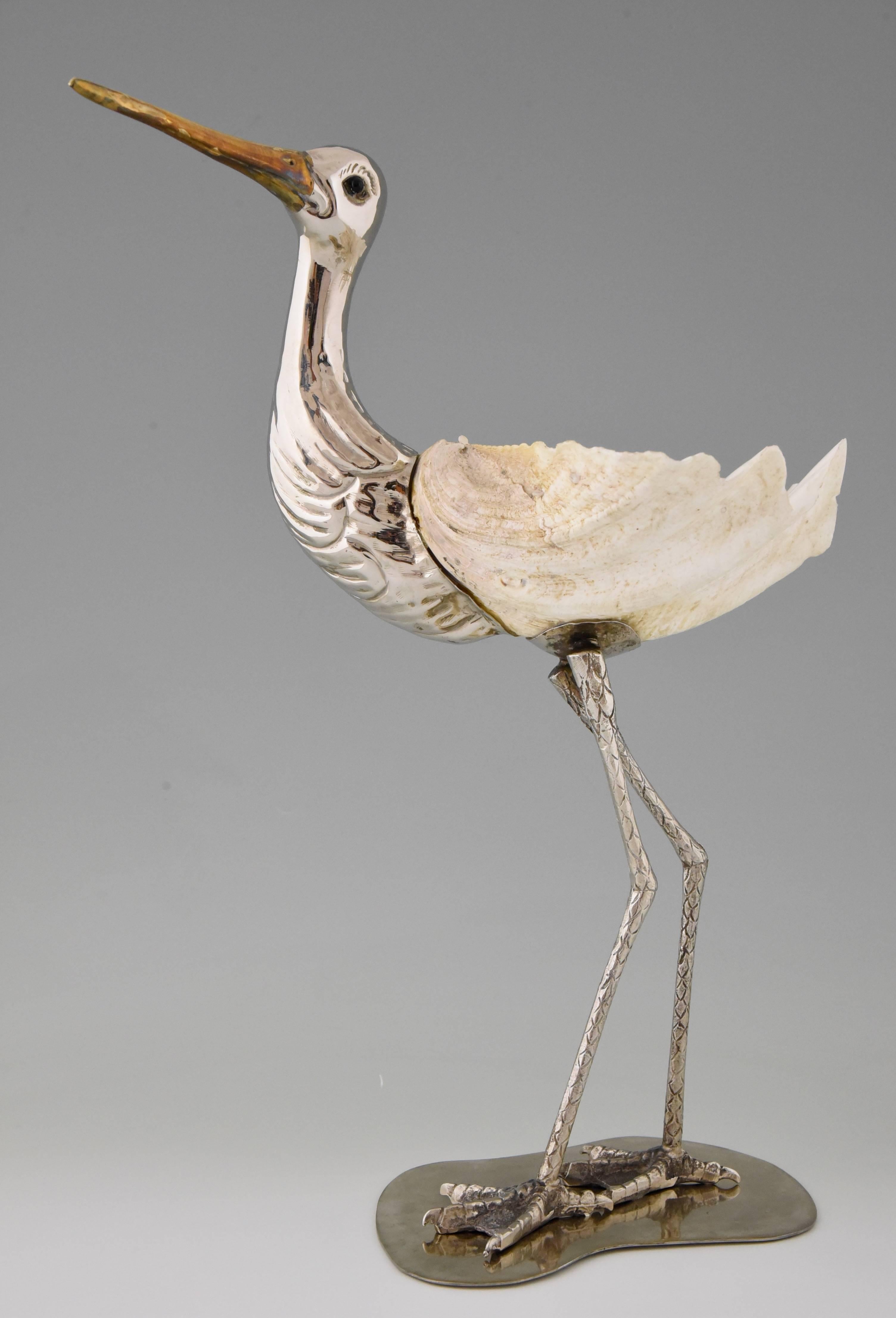 An impressive, elegant handcrafted Italian sculpture of a bird in silver plated brass and natural seashell by Gabriella Binazzi.

Artist / Maker:
Gabriella Binazzi
Style:
Contemporary. 
Date:
1980.
Material:
Silver plated brass and natural