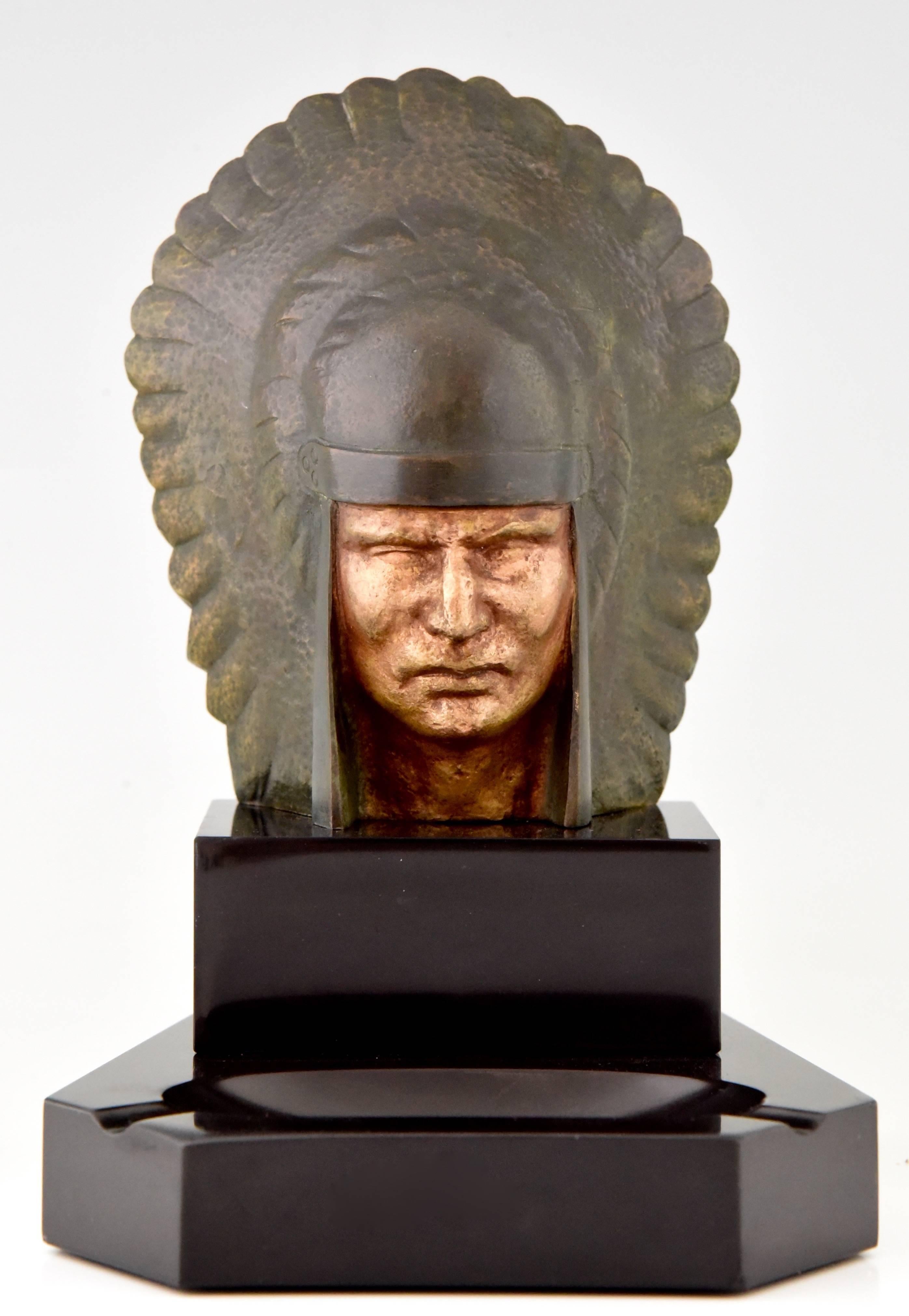 Stylish Art Deco bronze and marble ashtray with bust of an Indian by the French artist Georges Garreau.

Artist / Maker :
Georges Garreau.
Signature / Marks :
G. Garreau. 
Style :
Art Deco.
Date :
1930. 
Material :
Multi-color patina